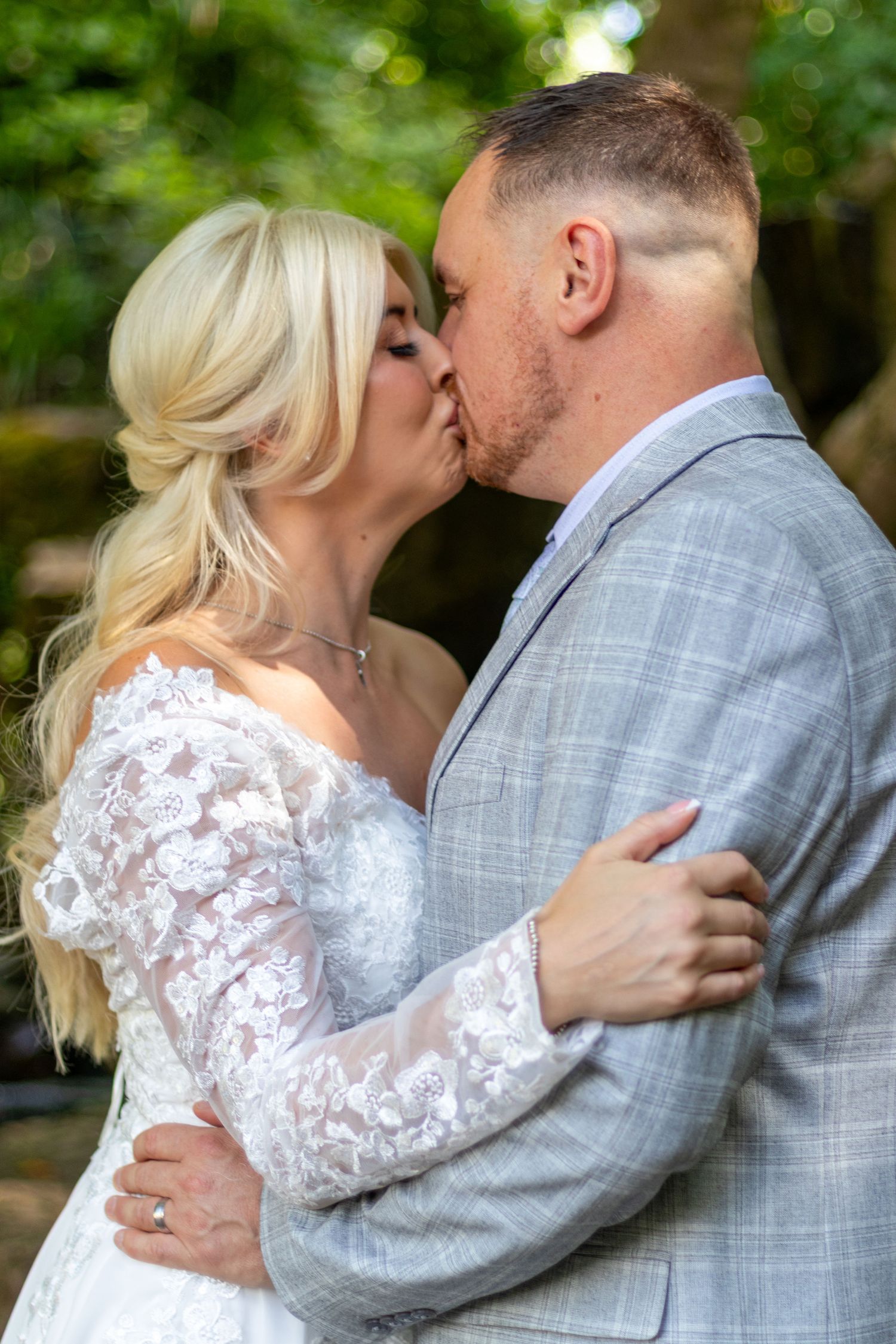 Couple kissing for Wedding portrait outdoors