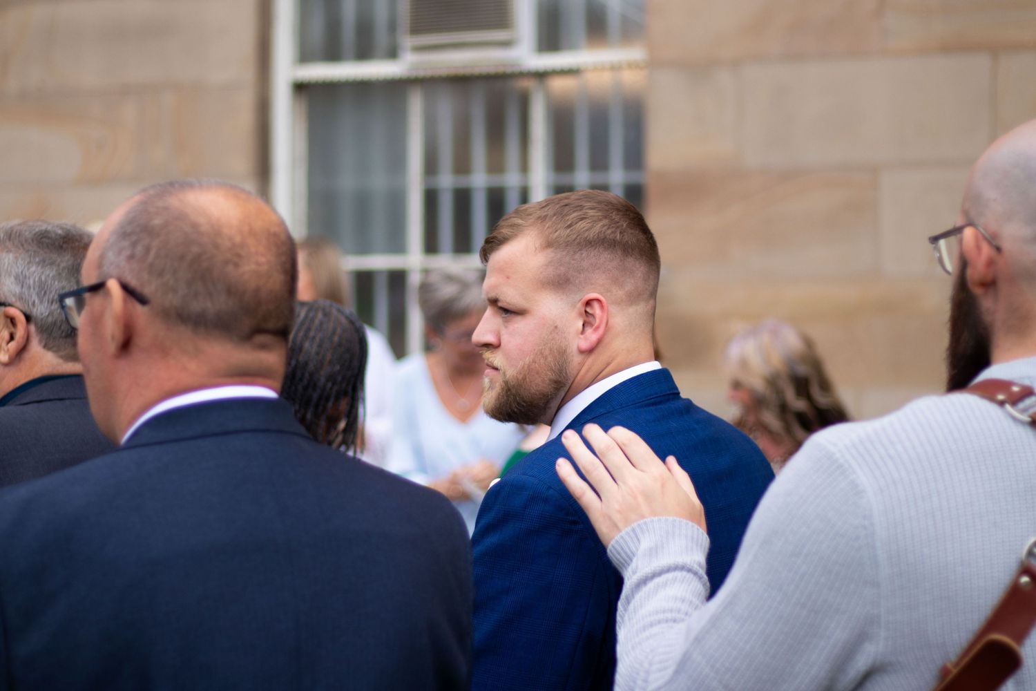 Wedding guests gathered outdoors at Clifton Park Museum