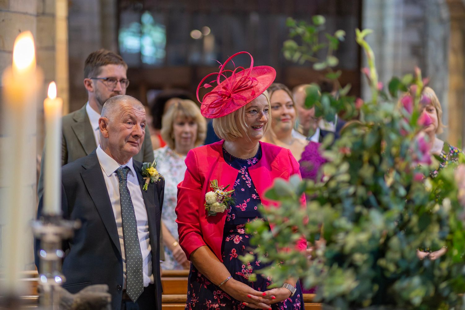 Wedding guests tear up watching a couple being married in a church