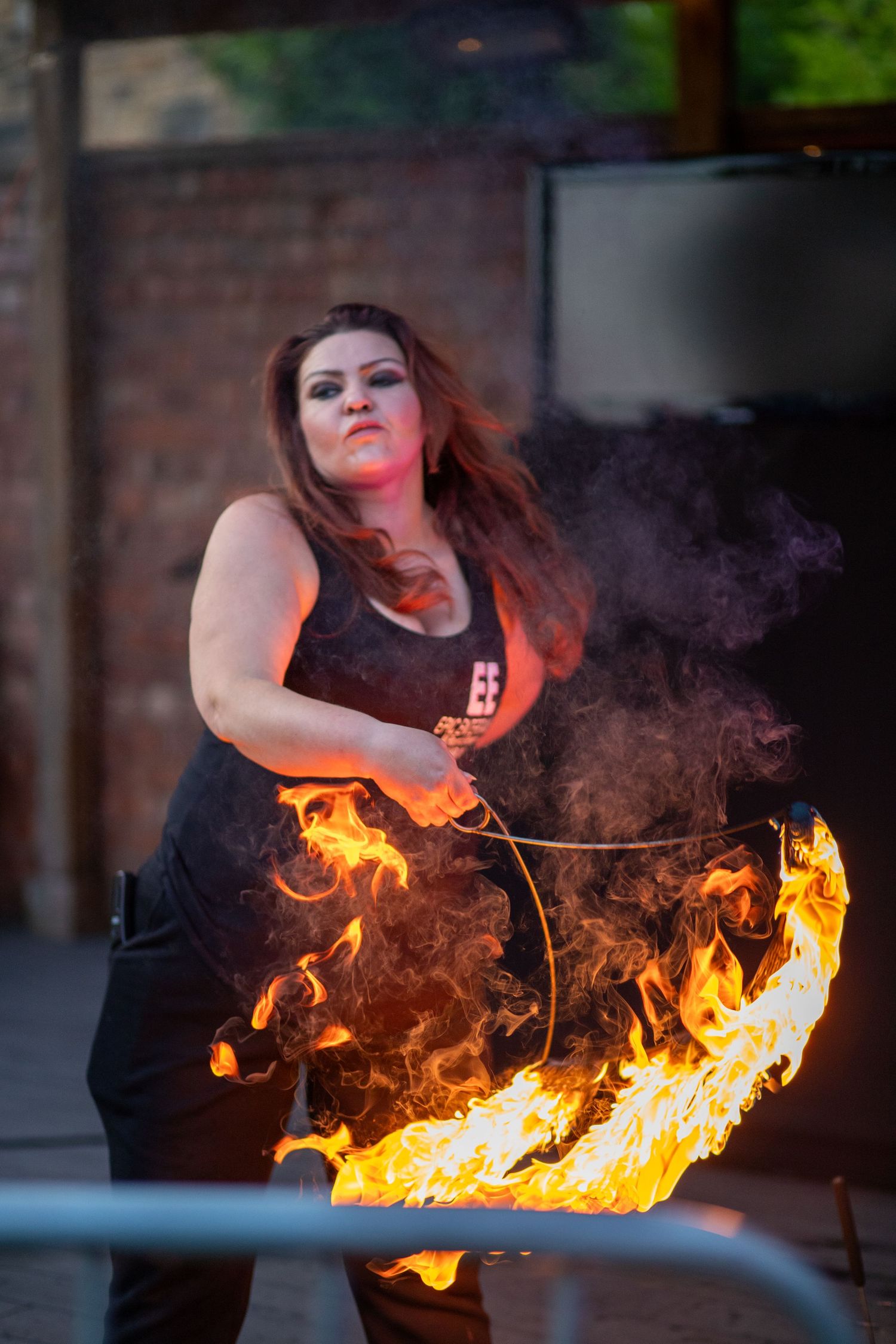 Woman Fire Dancing  at dusk