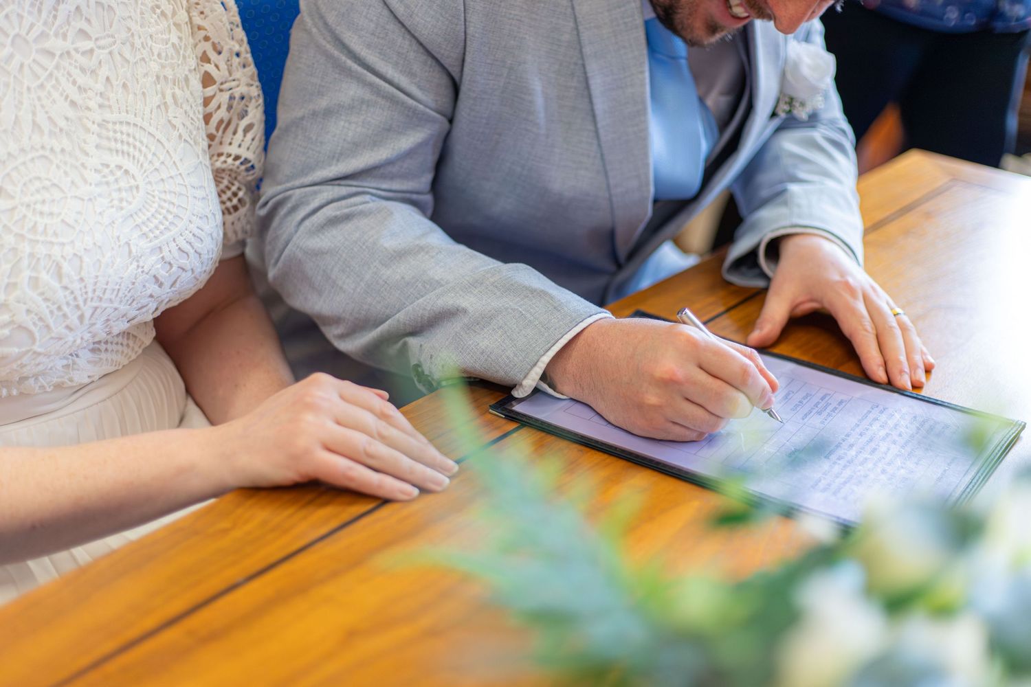 Bride and groom signing the marriage register at Barnsley Town Hall