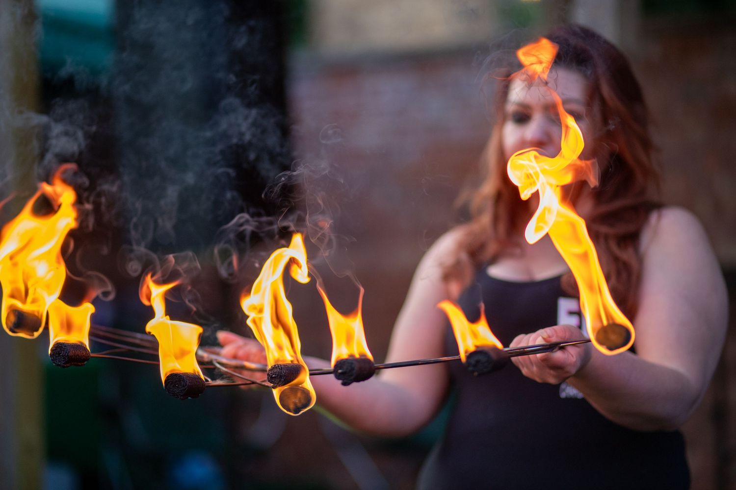 Woman Fire Dancing  at dusk
