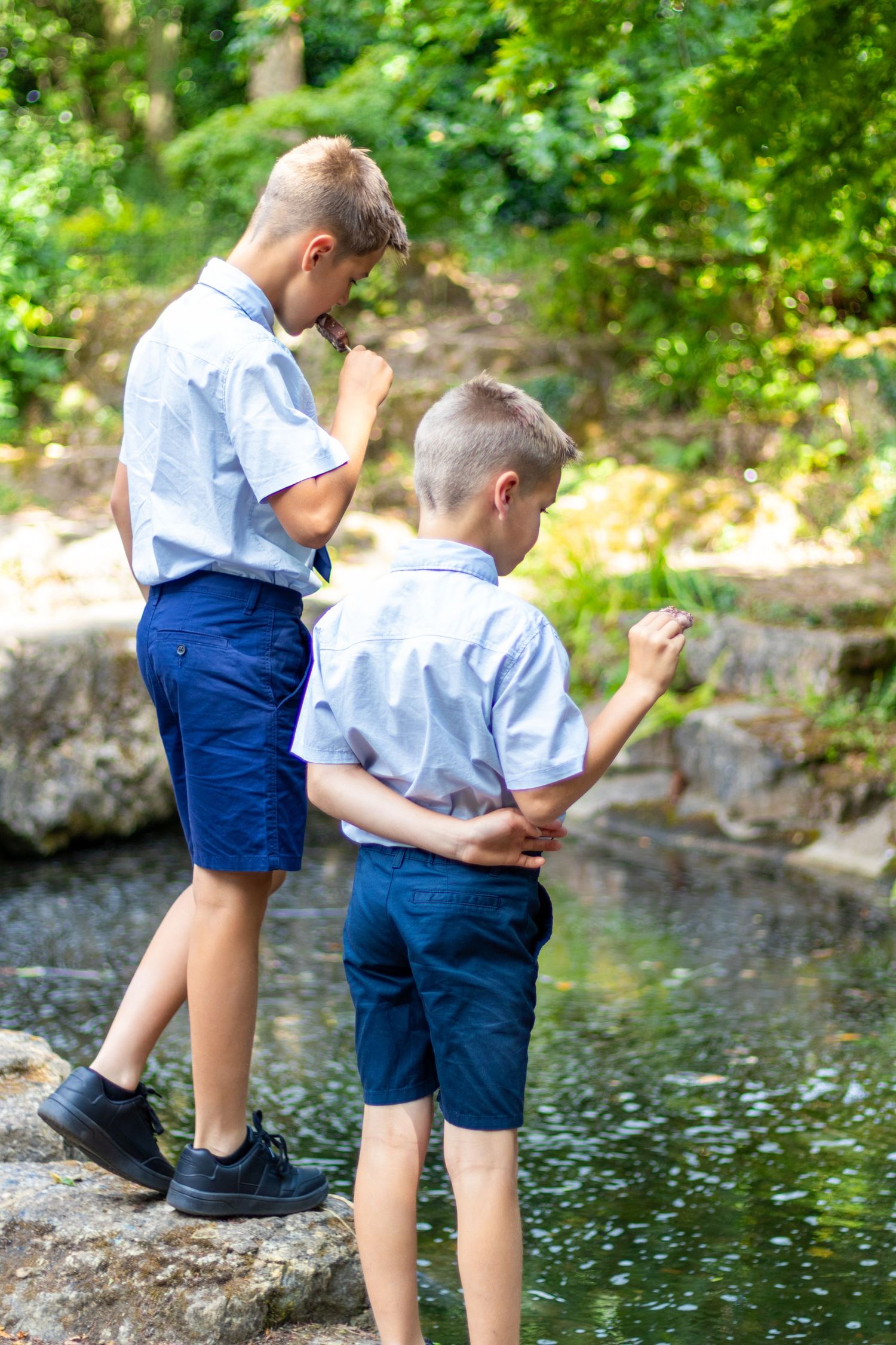 Candid photo of children with ice-cream resting during a wedding