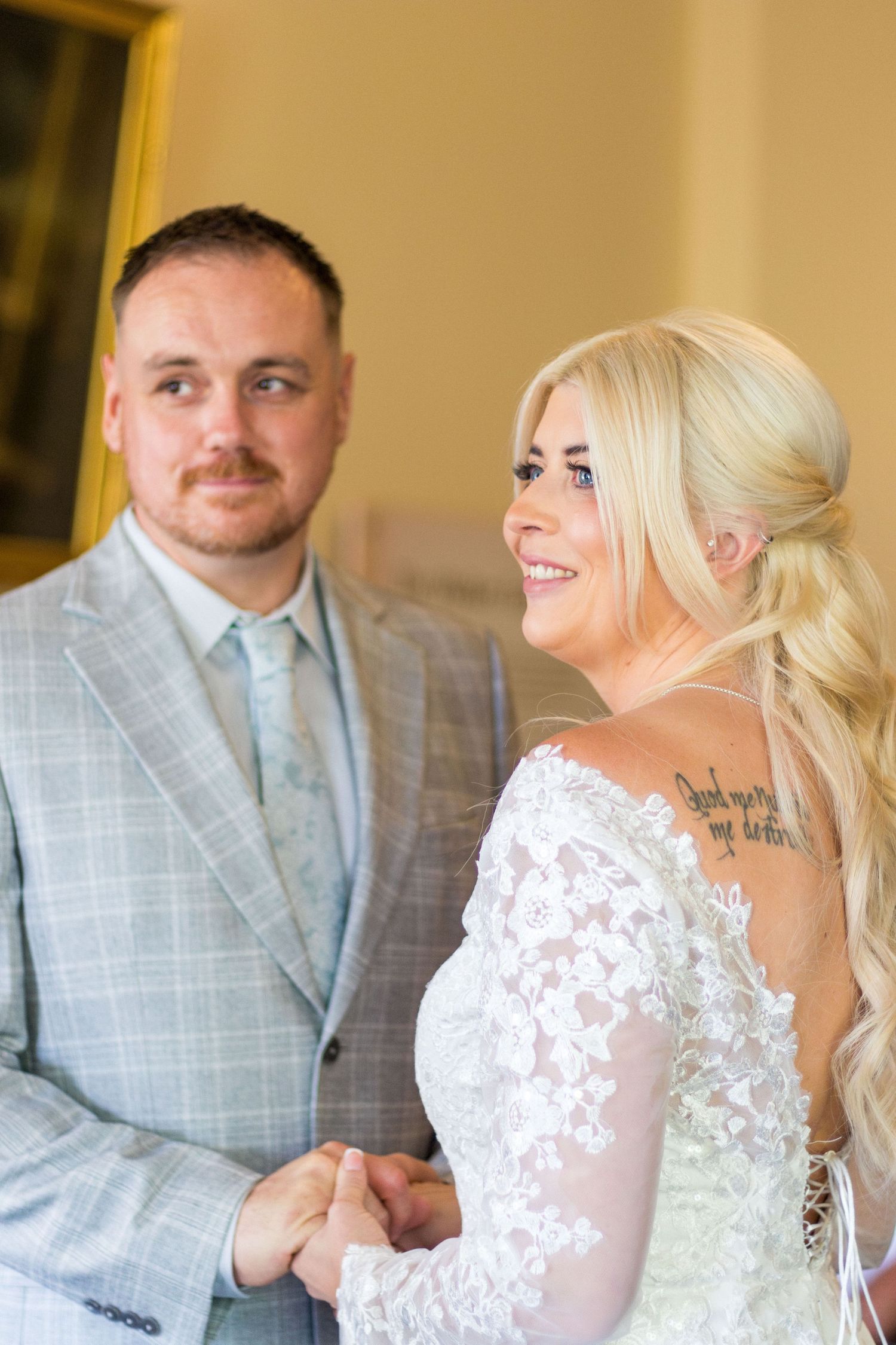 Bride and groom posing together at Clifton Park Museum
