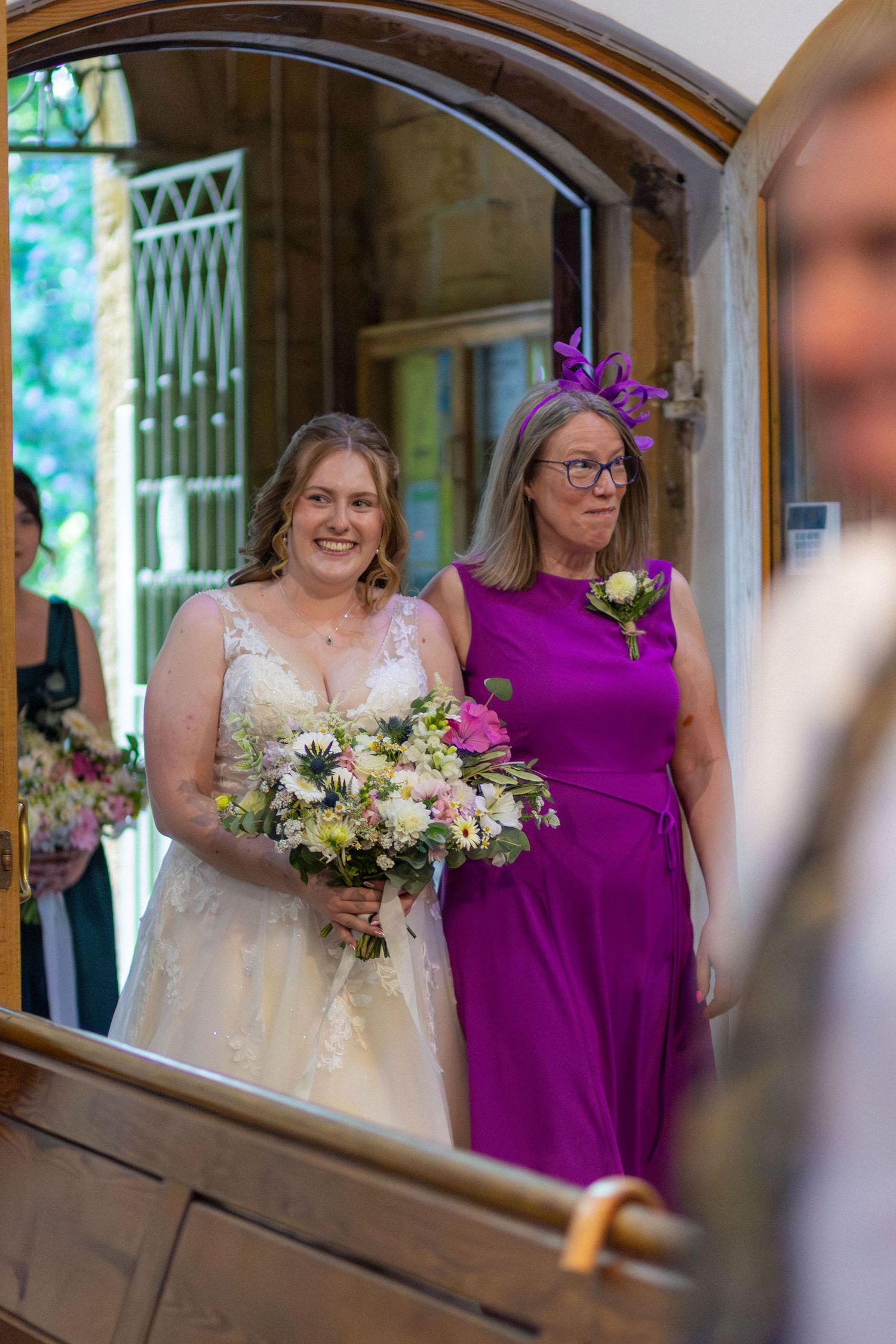 Wedding guest standing in the doorway at Eckington Church