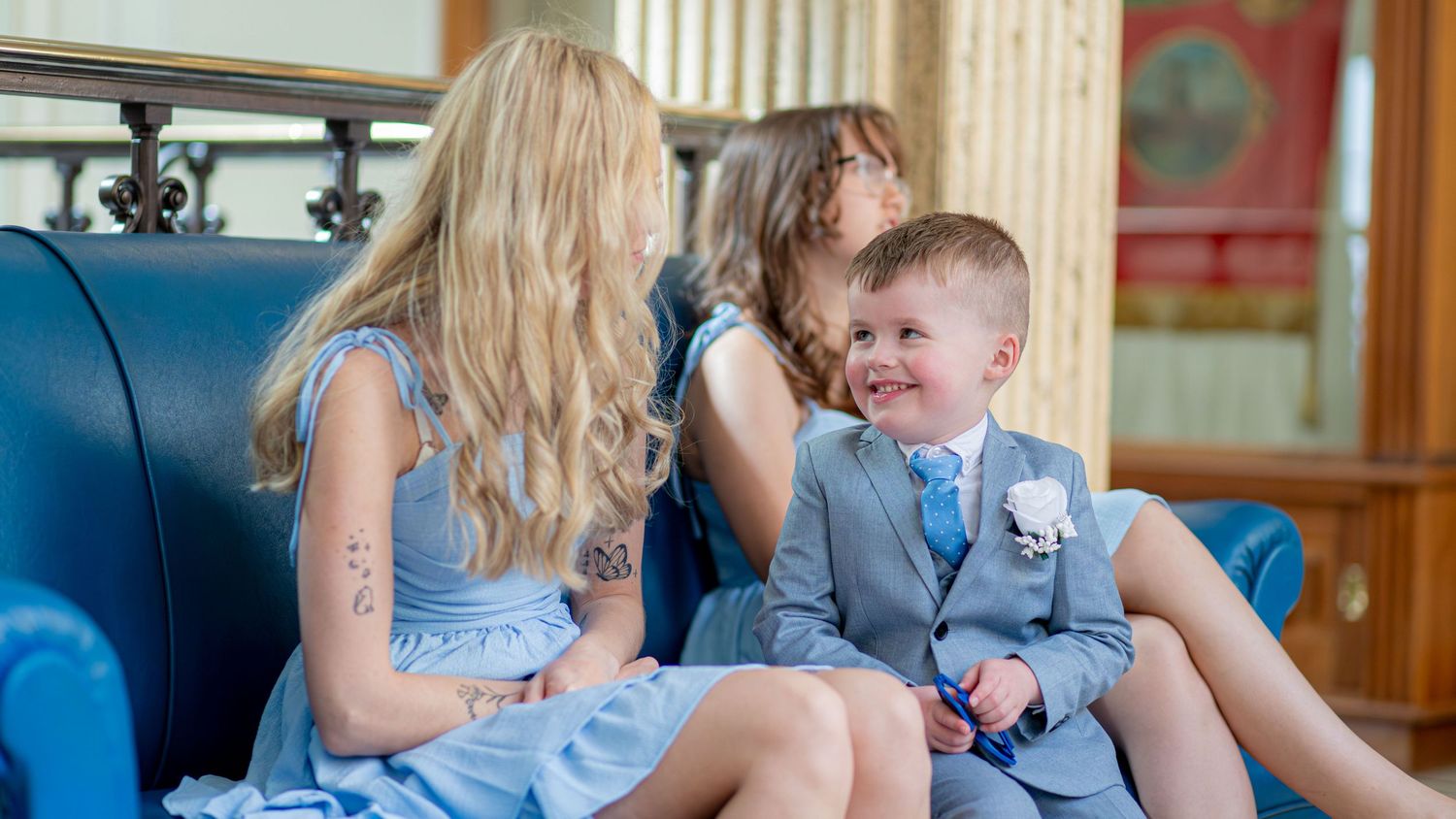 Bride interacting with a young child during the wedding at Barnsley Town Hall.