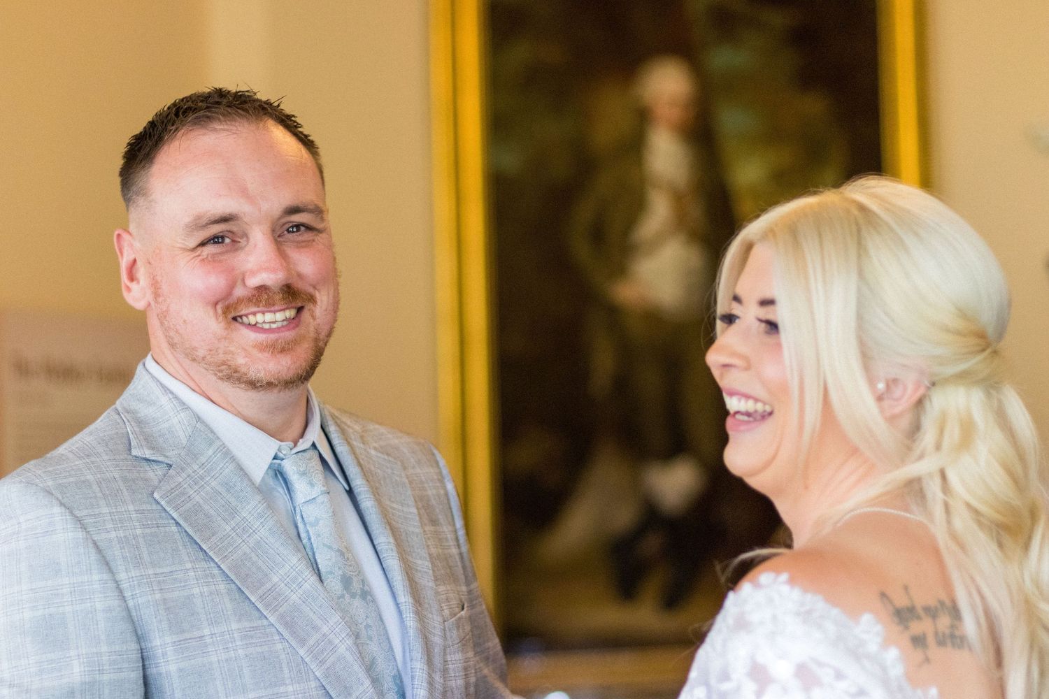 Bride and Groom laughing during their Wedding
