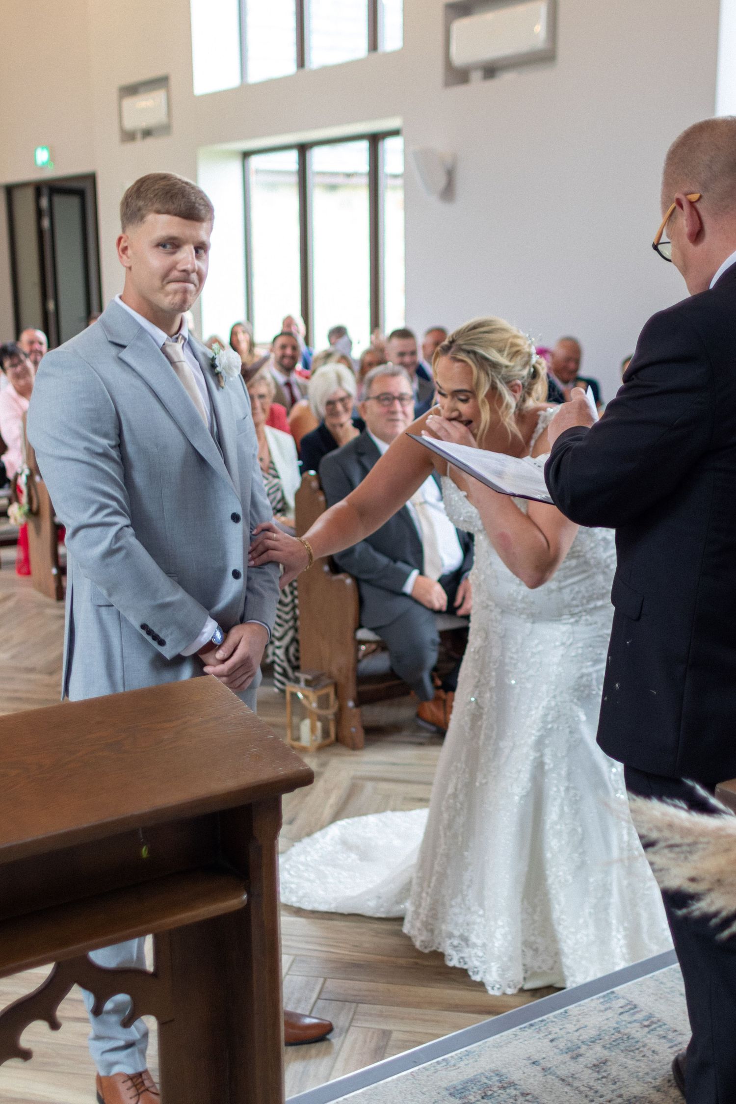 Bridge and Groom laughing at each other during their Wedding
