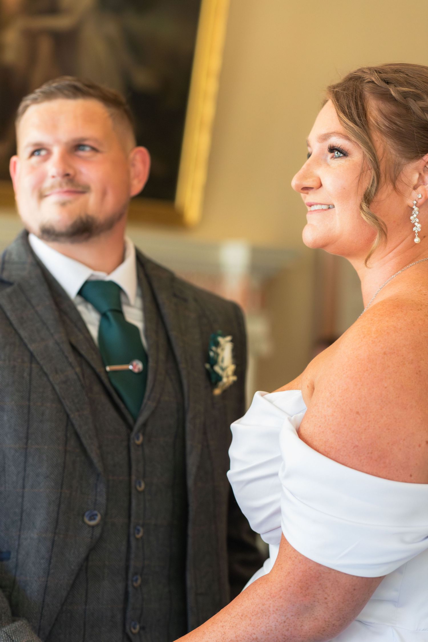 Bride and groom sharing a moment during their wedding at Clifton Park Museum