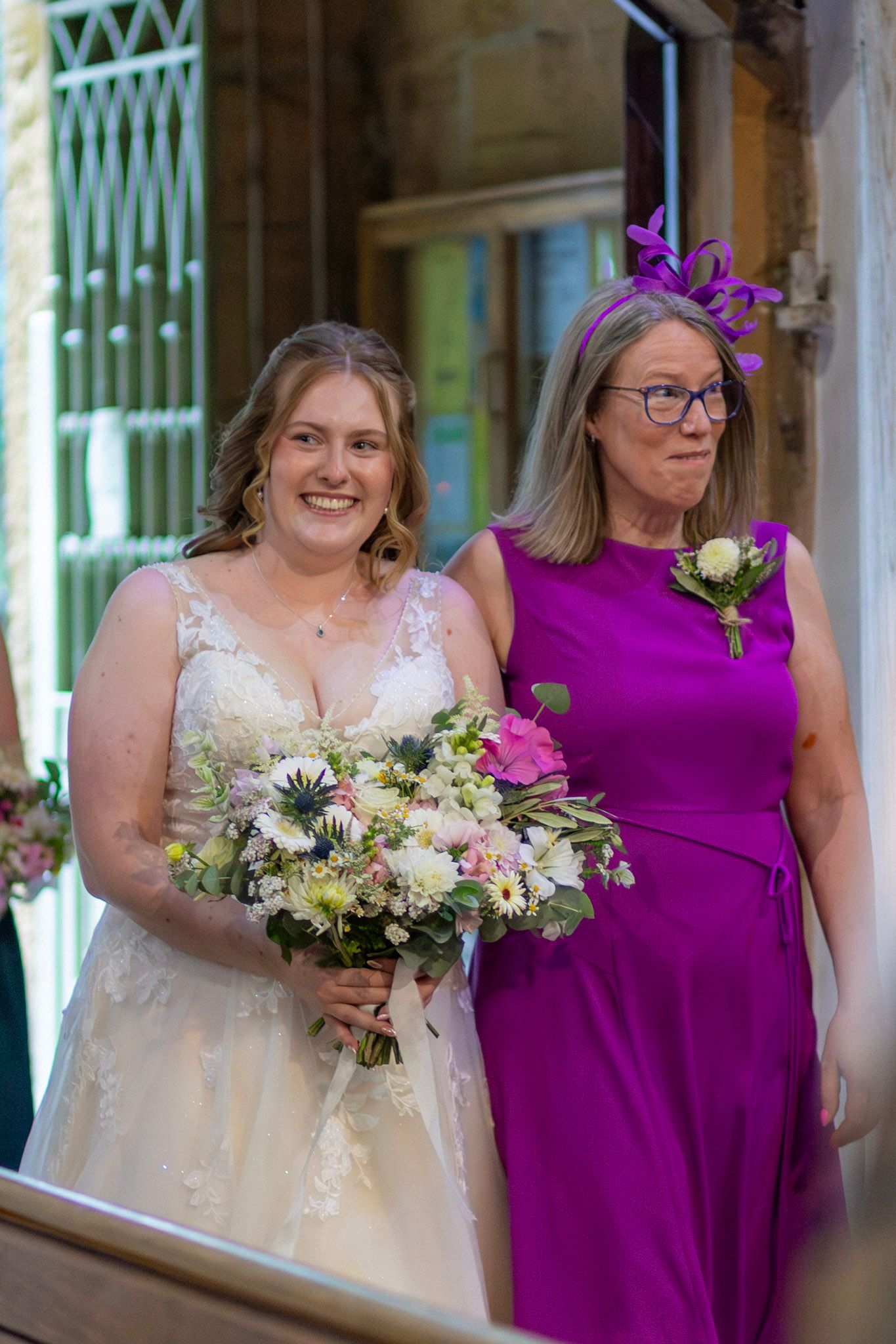 A Bride and her mother enter their church venue for their wedding