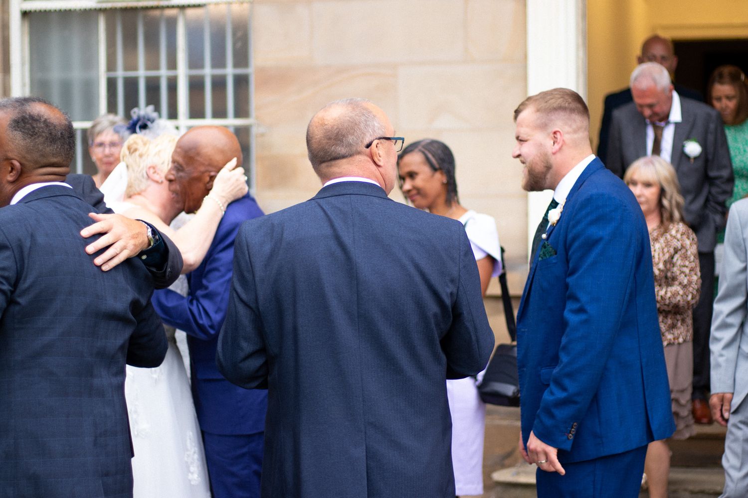 Family embrace after a Wedding outdoors