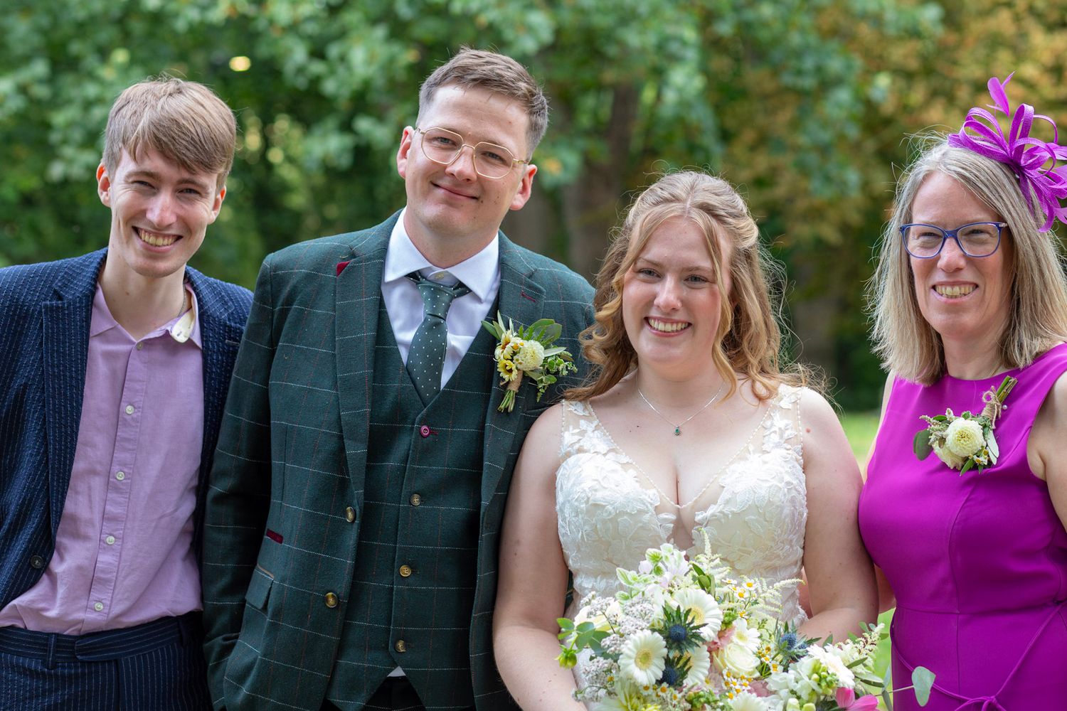 Candid family group photo of the Bride and Groom
