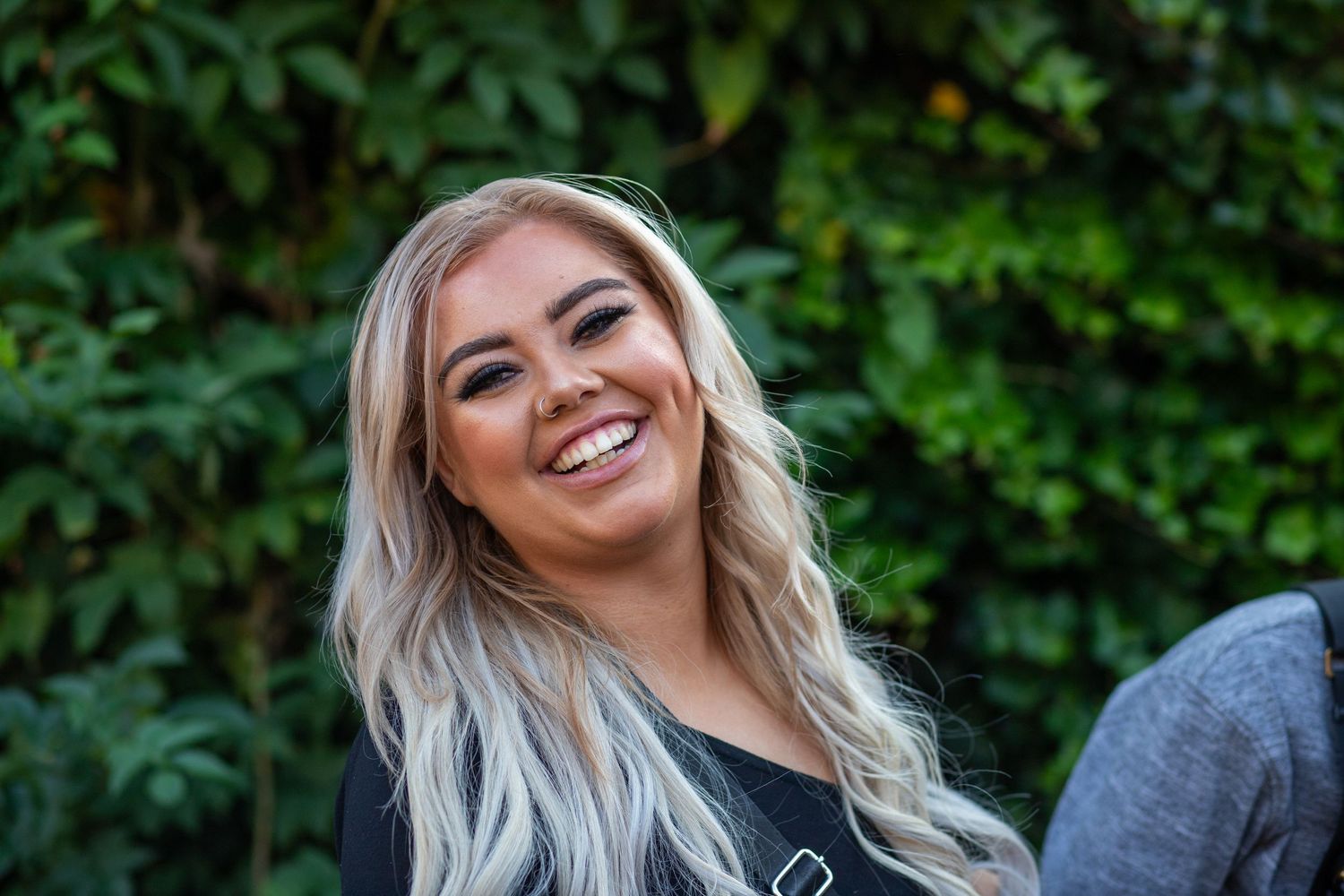 Woman posing for the camera at a public event
