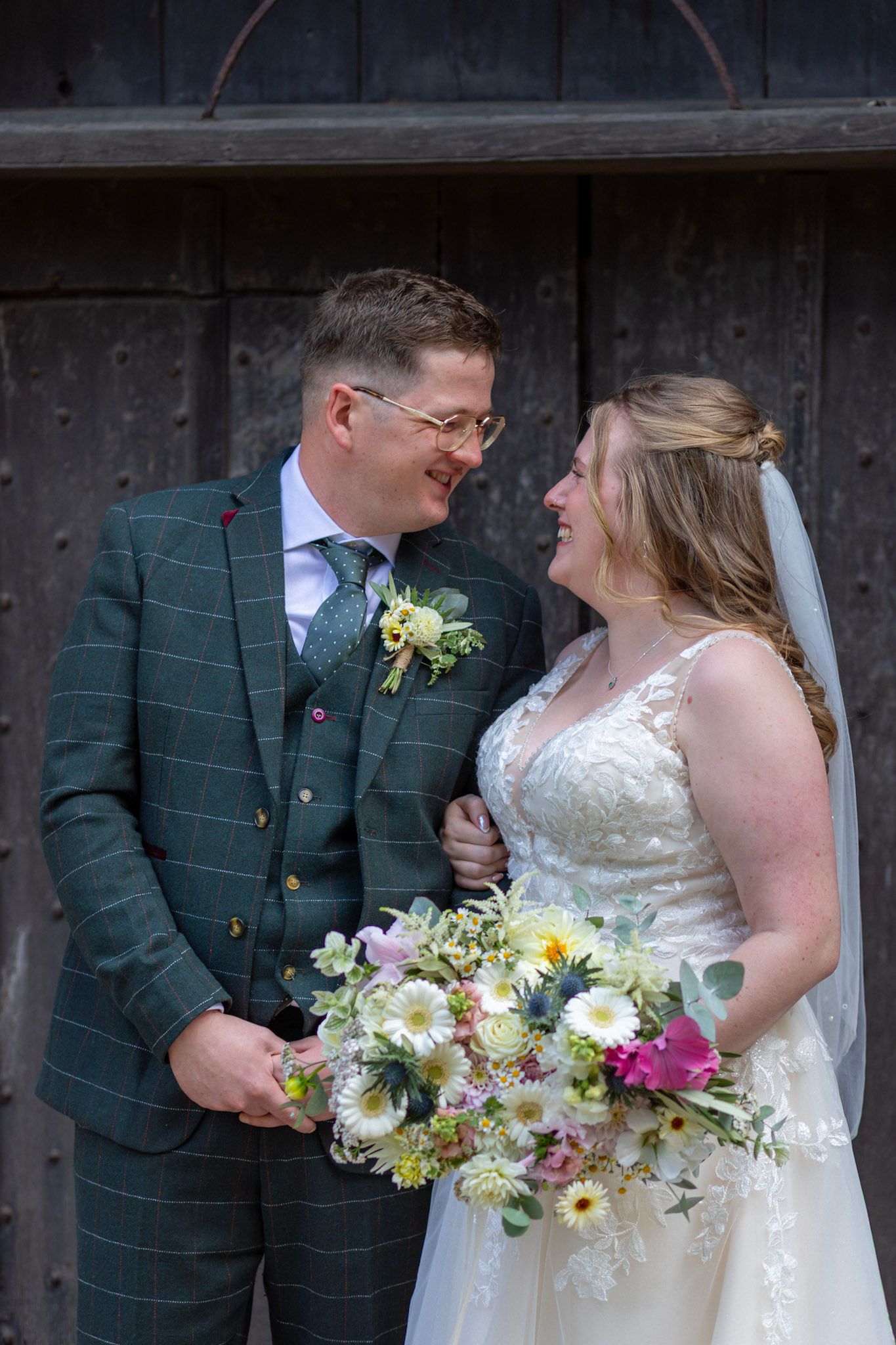 A Bride and Groom share a personal moment after their wedding ceremony