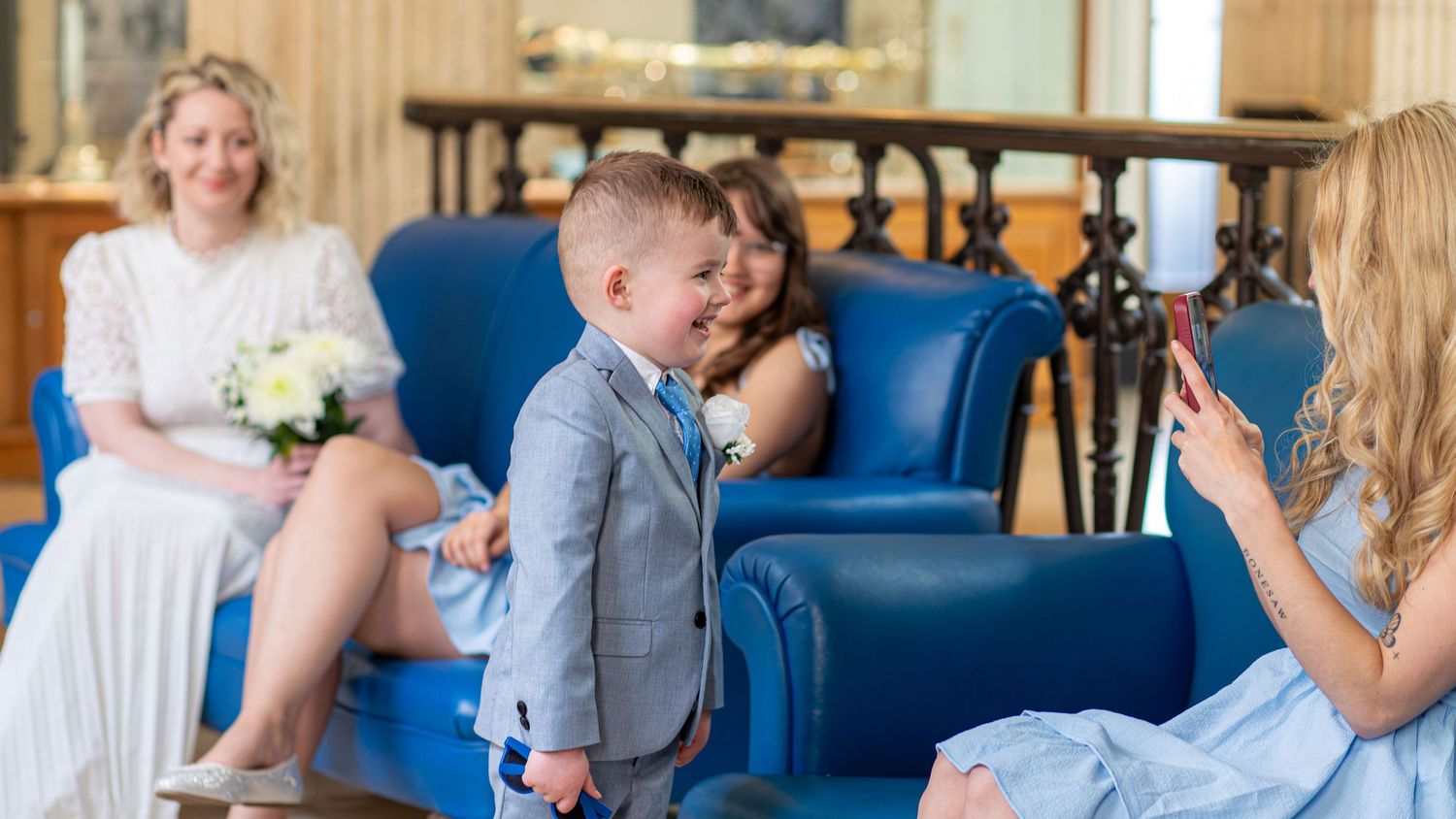 Young wedding guest standing beside the bride at Barnsley Town Hall