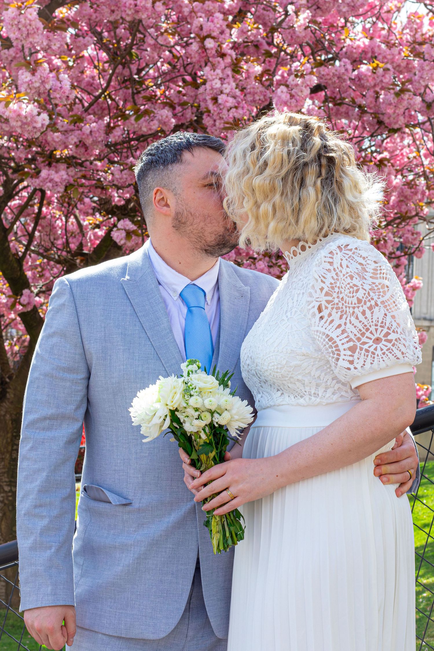 Bride and groom posing together outdoors at Barnsley Town Hall