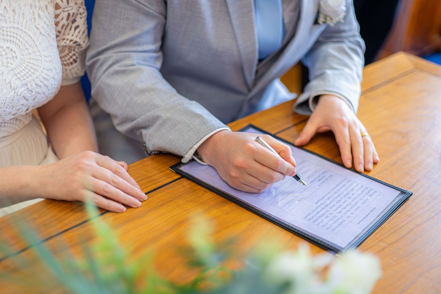 Bride and groom signing the wedding register at Barnsley Town Hall.
