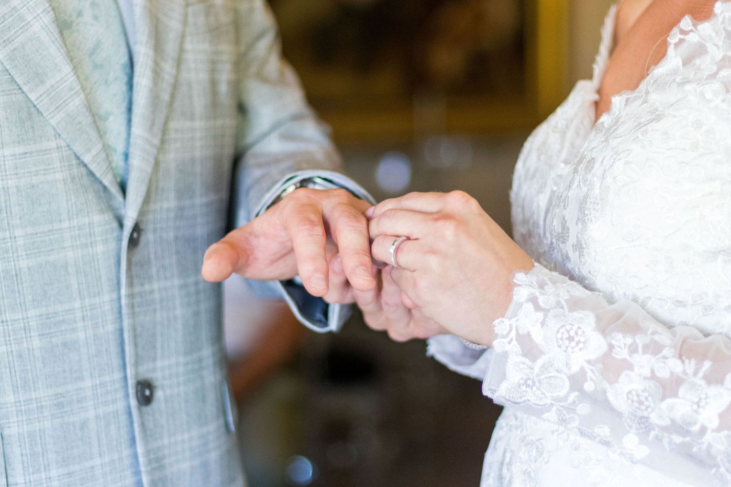 Bride and Groom exchanging rings during their Wedding
