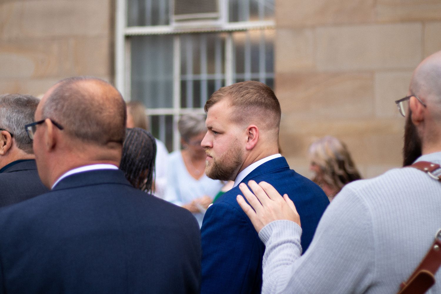 Photographer supporting Best Man at Wedding