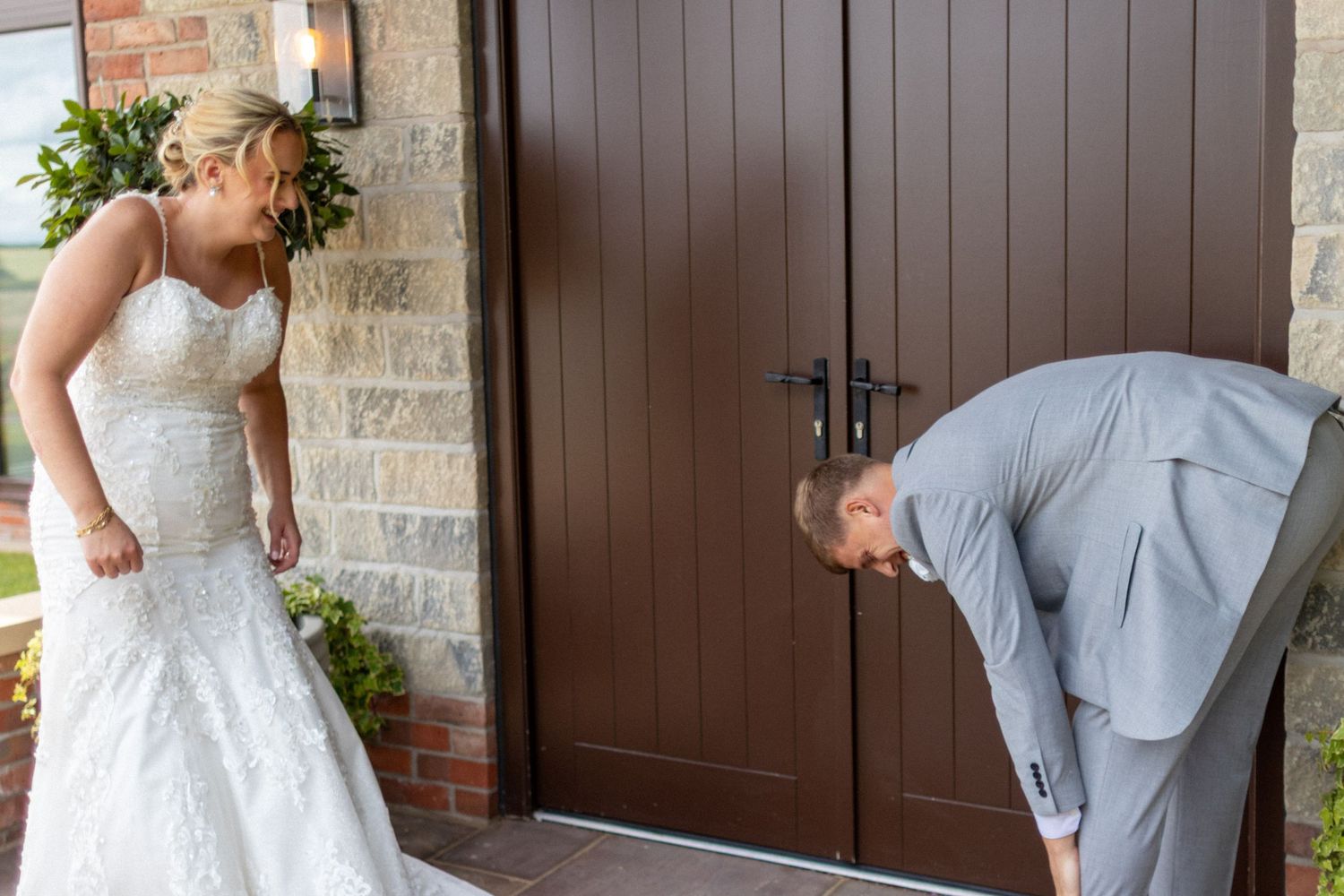 Bridge and Groom laughing at each other after their Wedding
