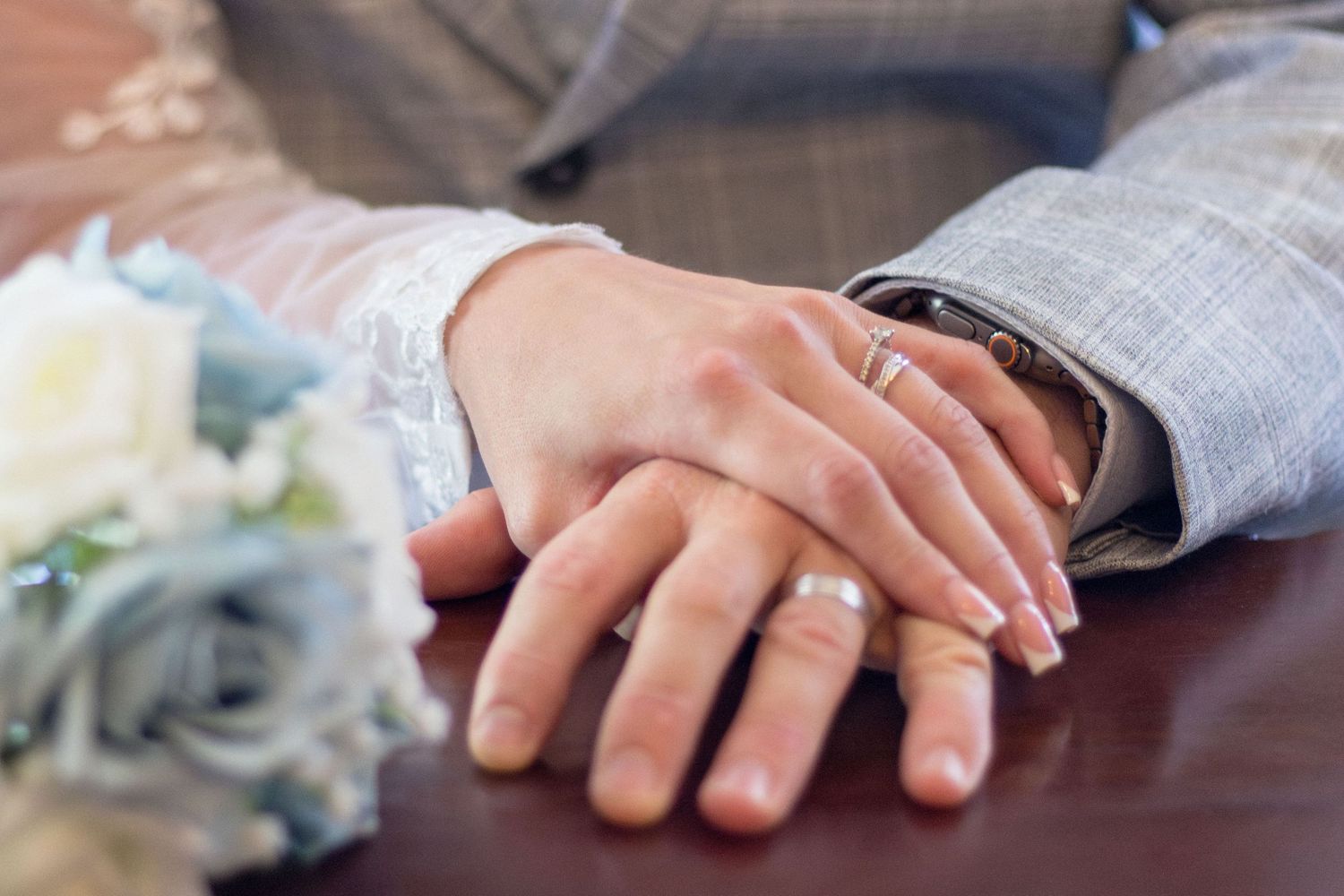Wedding rings on the hands of the newlyweds at Clifton Park Museum