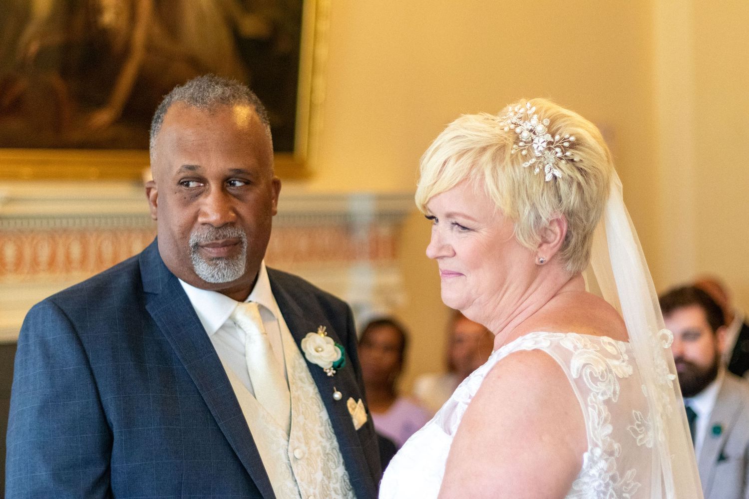 Bride and groom sharing a moment during their wedding at Clifton Park Museum