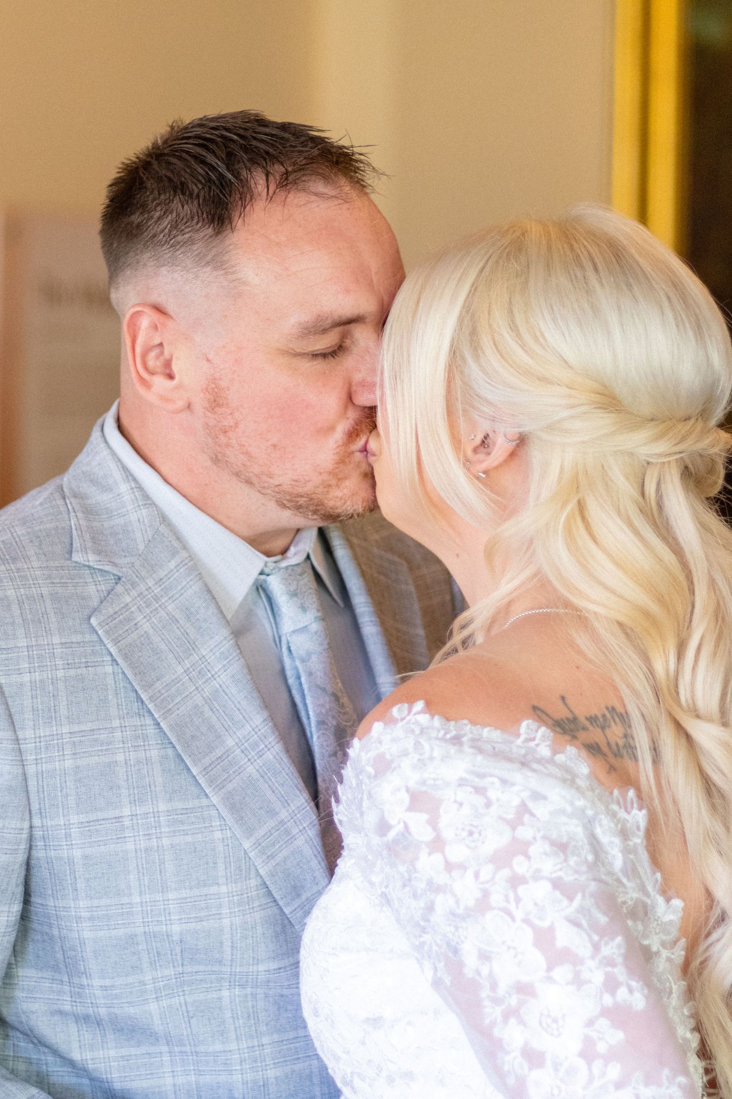 Bridge and Groom kiss at their wedding