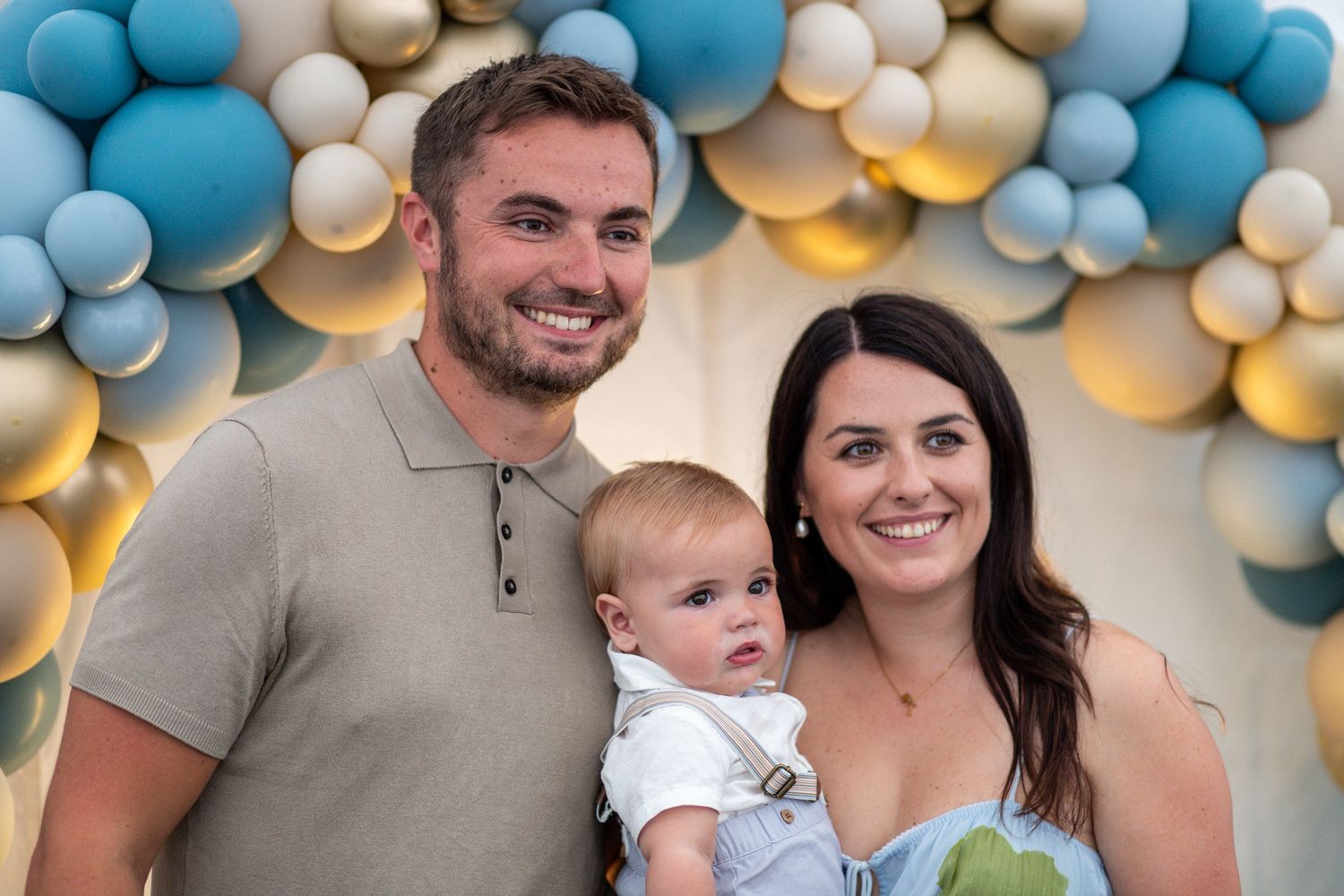 Couple with son at Balloon Christening