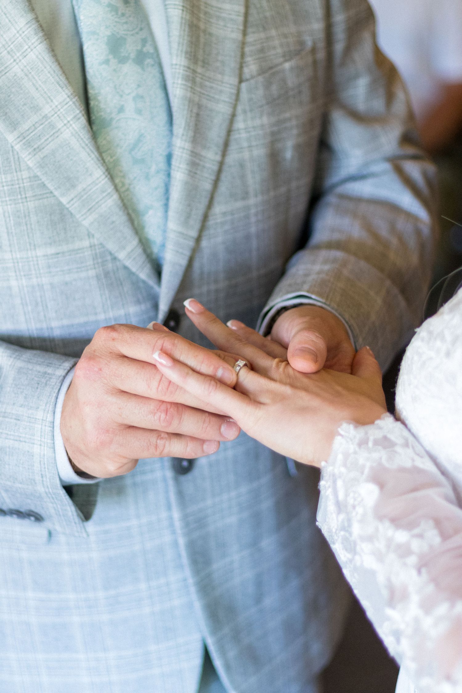 Bride and Groom exchanging rings during their Wedding