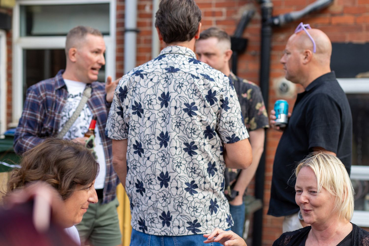 Friends outdoor at a garden party talking