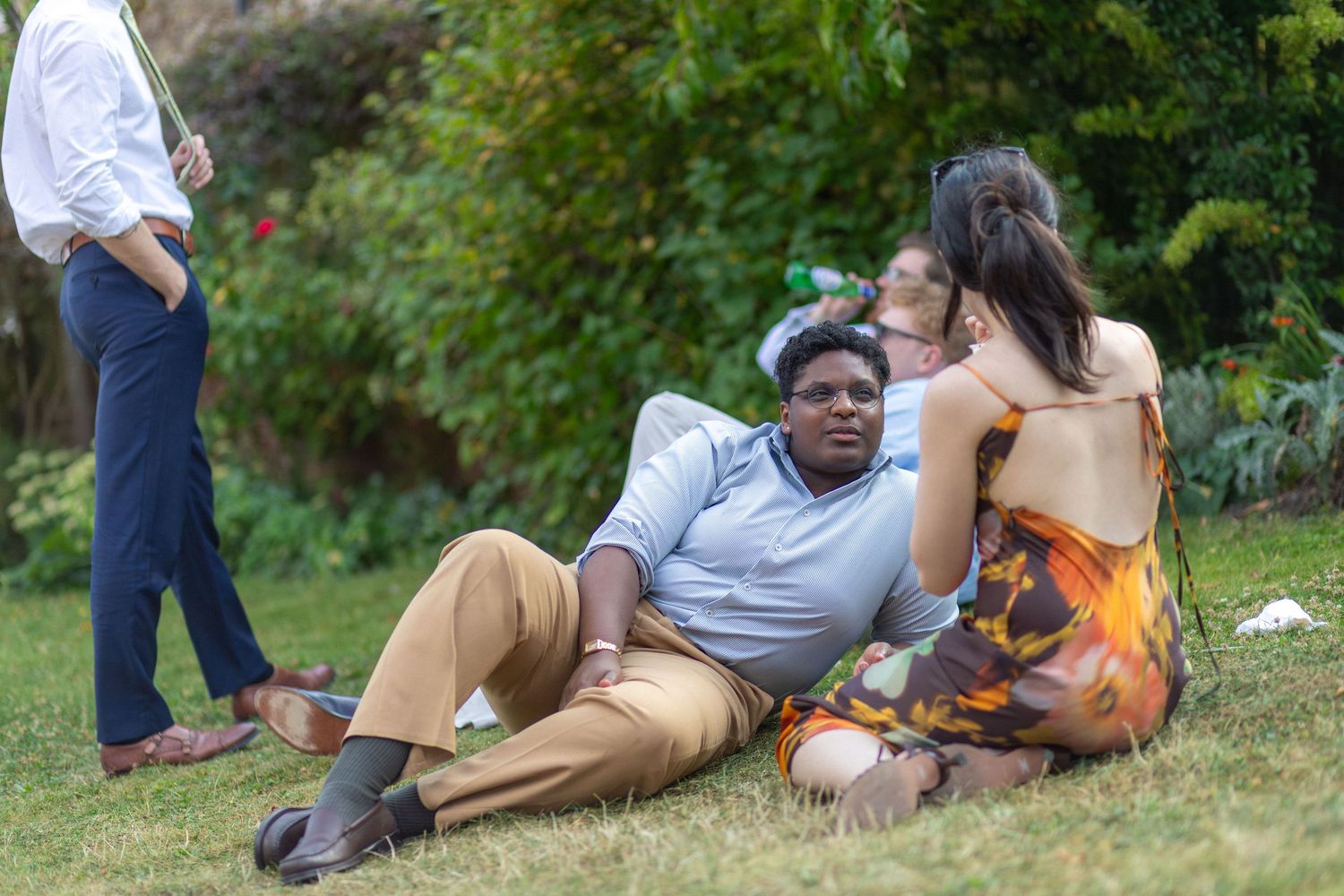 Wedding guests relaxing outdoors at Manor Lodge
