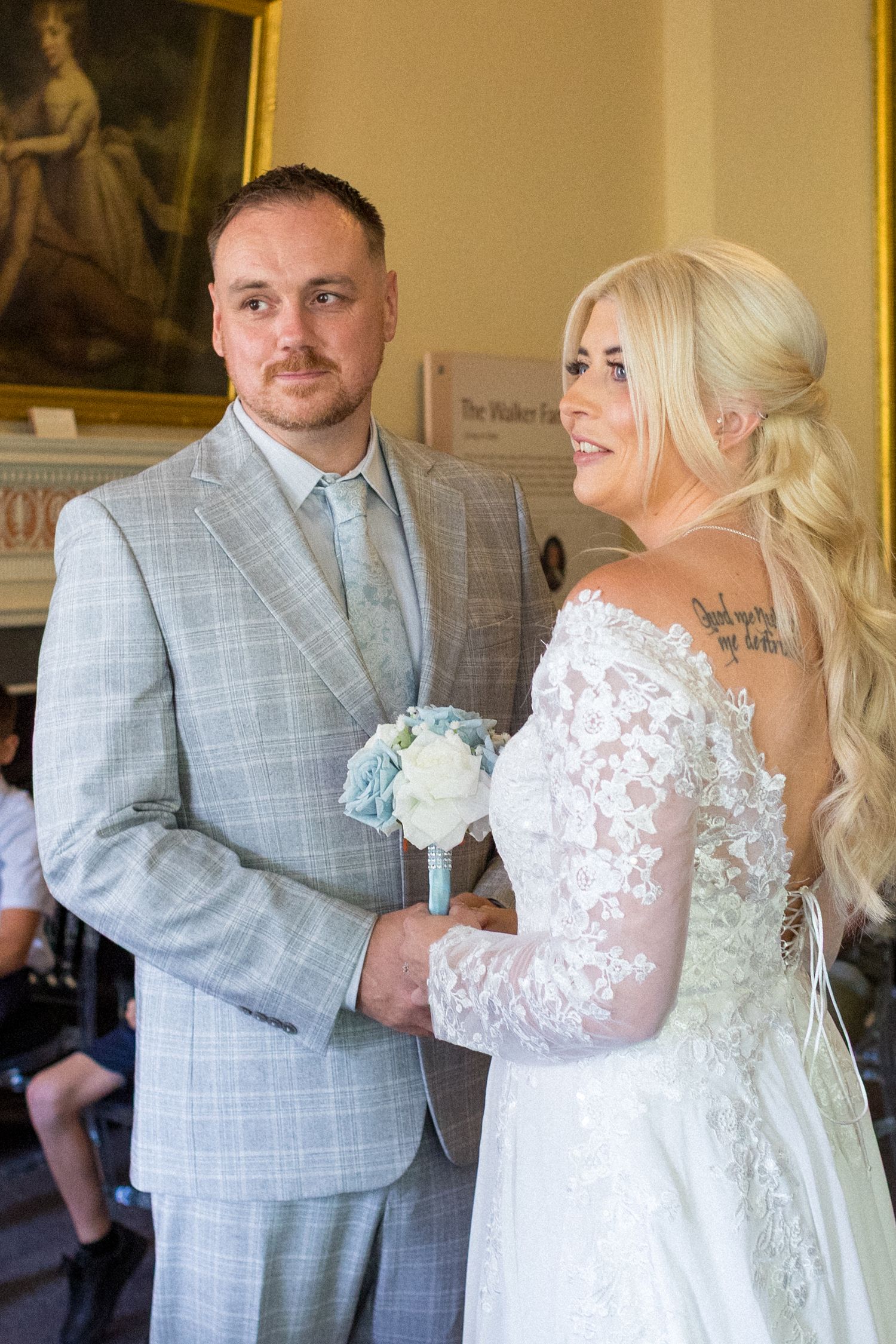 Bride and Groom holding hands at their Wedding
