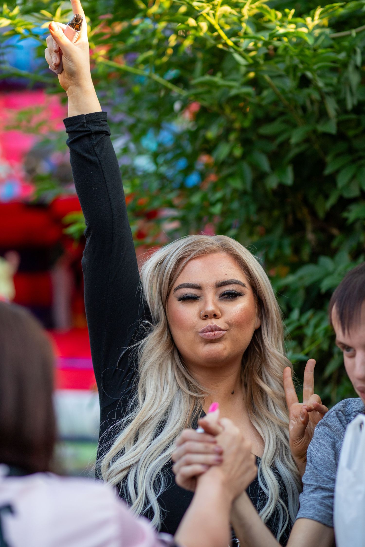 Woman posing for the camera at a public event