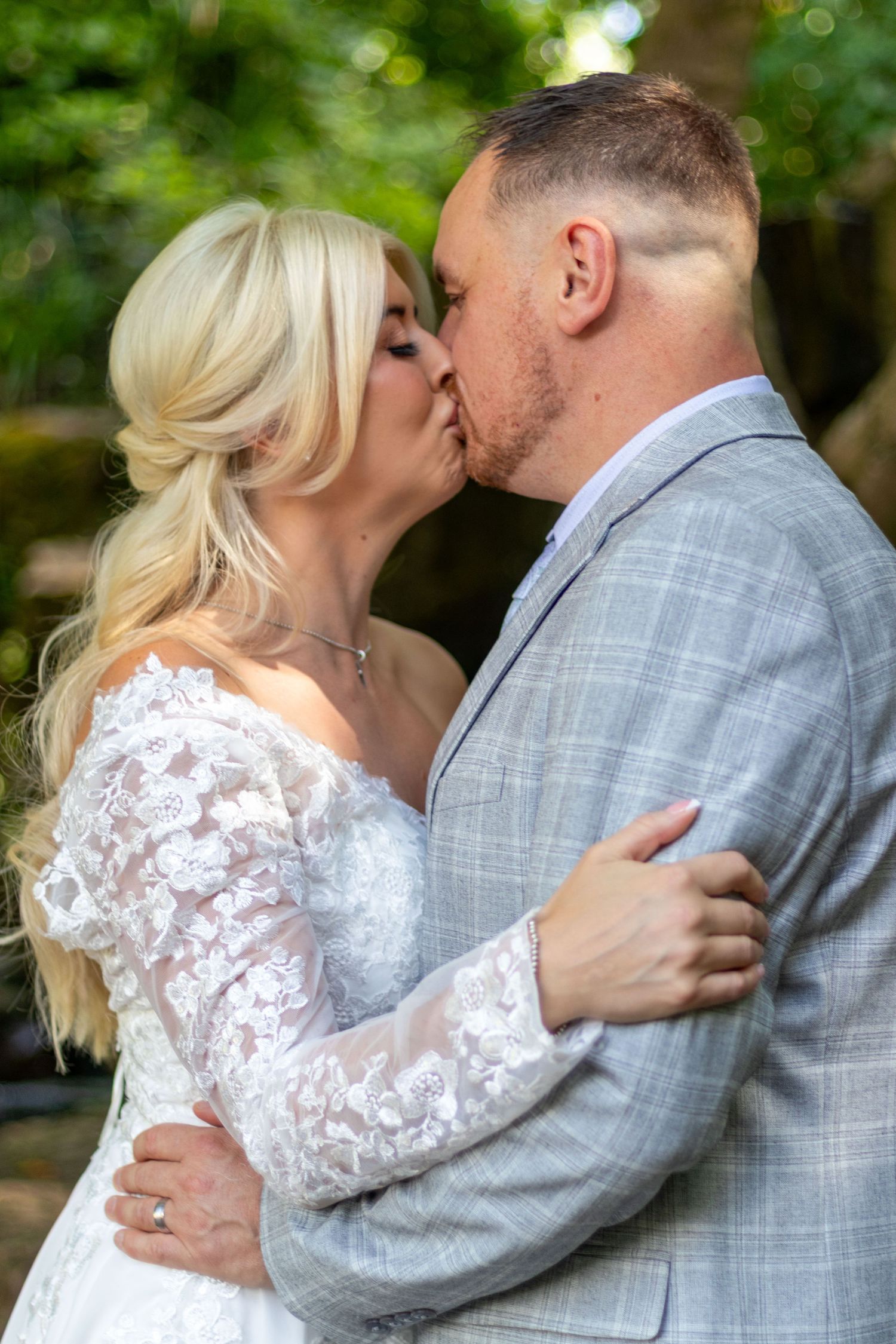 Bride and groom sharing a kiss at Clifton Park Museum