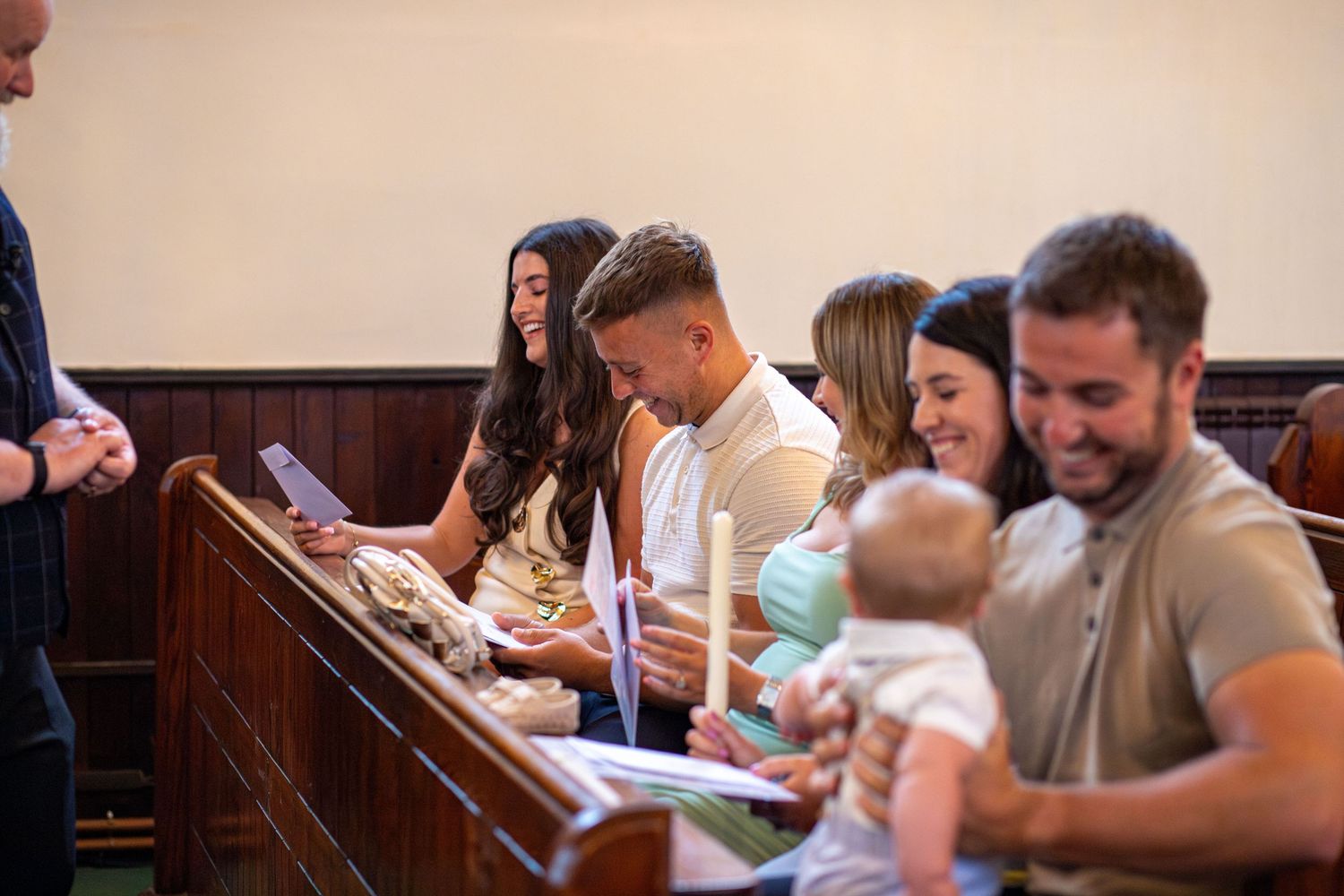 Family with their baby during the christening ceremony at St Thomas Church, Barnsley
