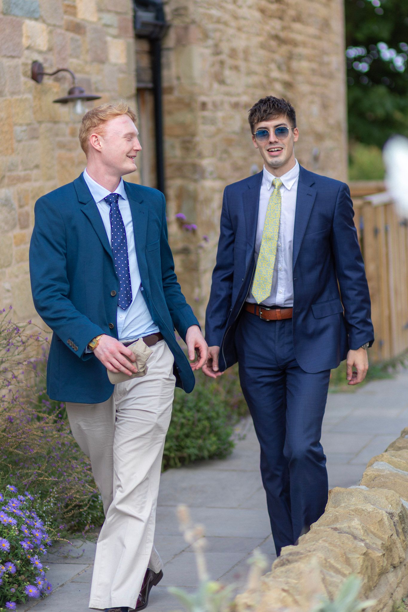 Guests arrive at the wedding reception in their suits
