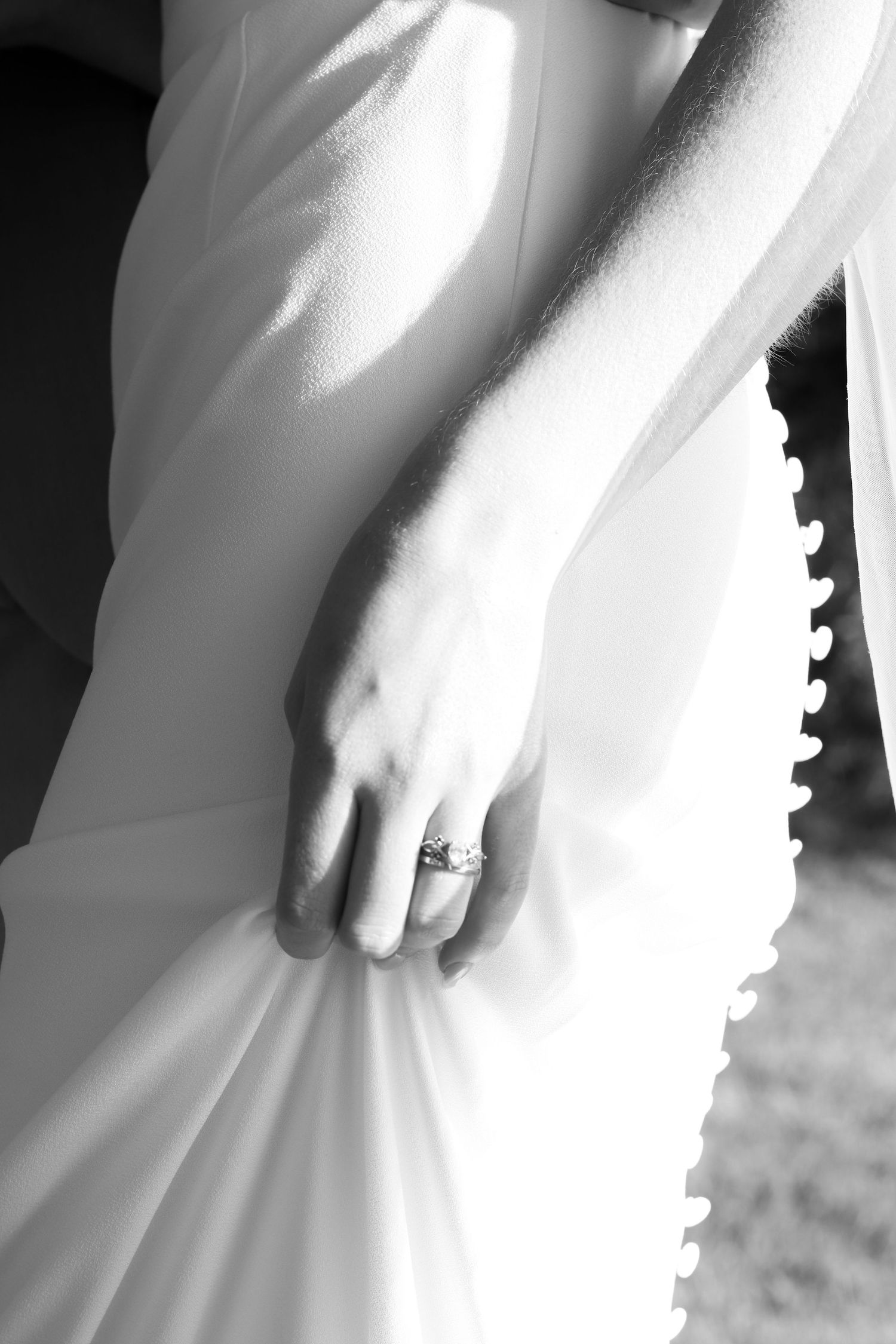 Brides hand and dress