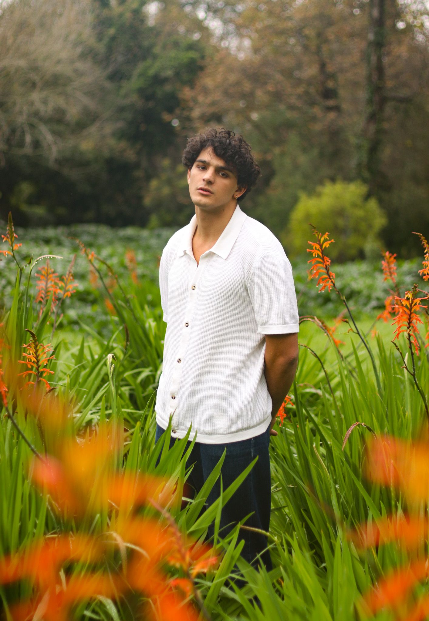 Young man in field of flowers