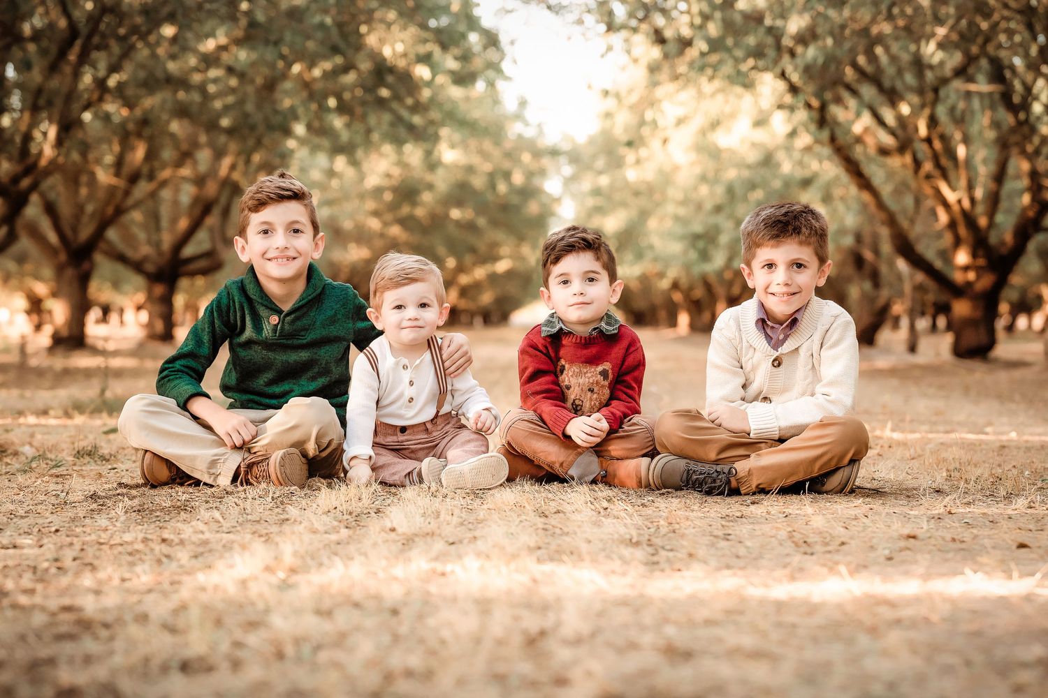 Kids sitting in the ground