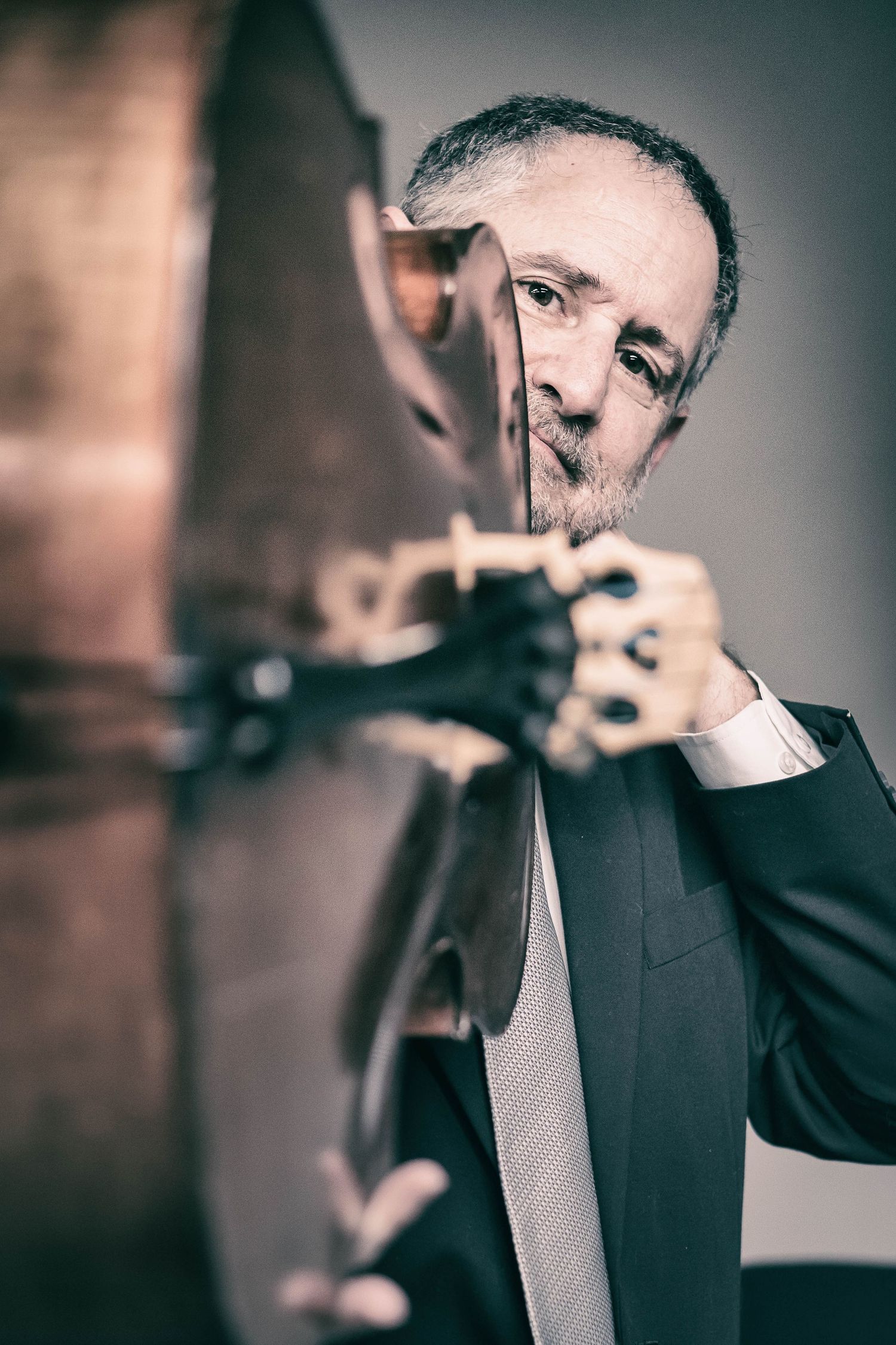 Fine art photography male cellist with cello