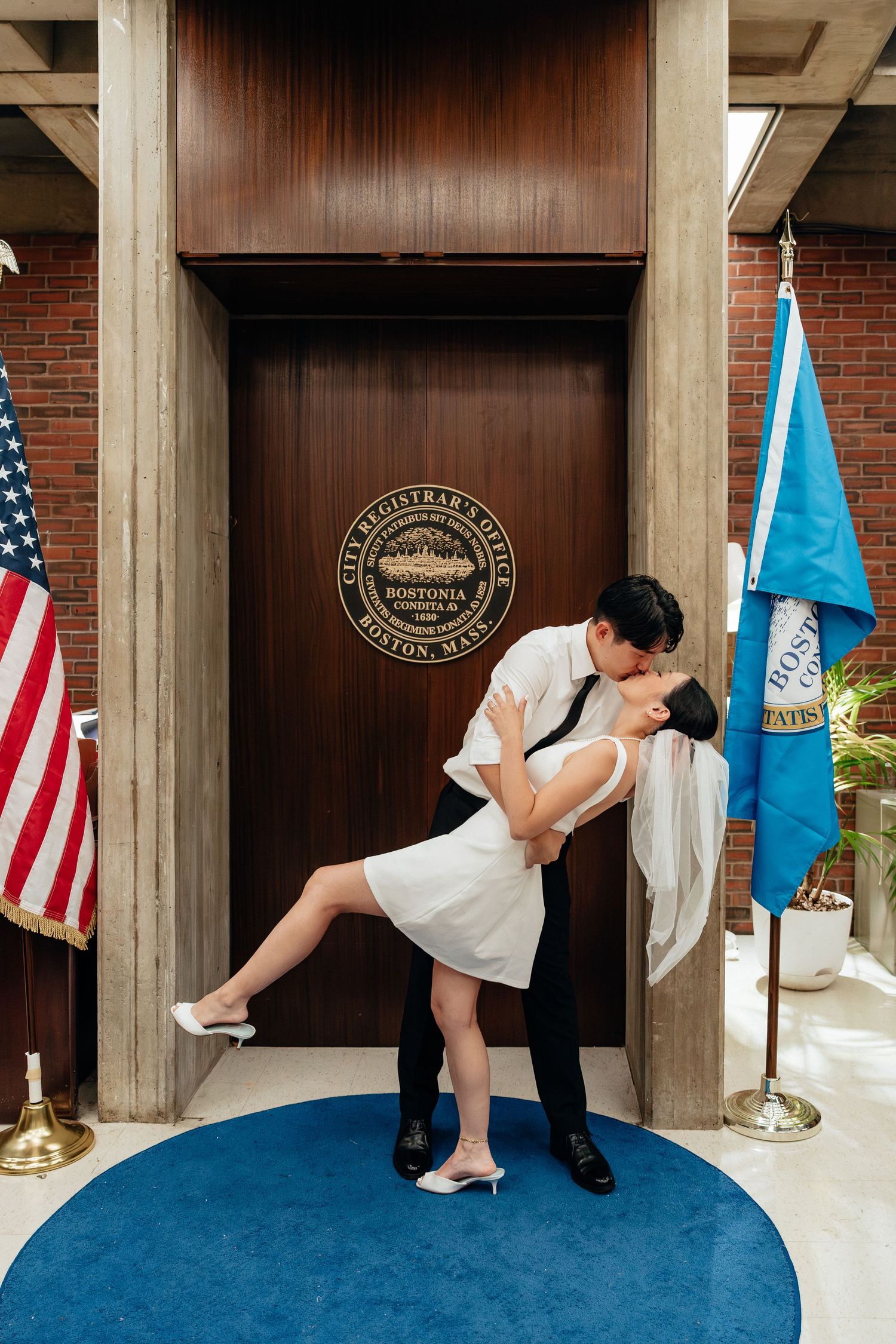 Playful dance sequence showing dips and spins against a backdrop with American flags.