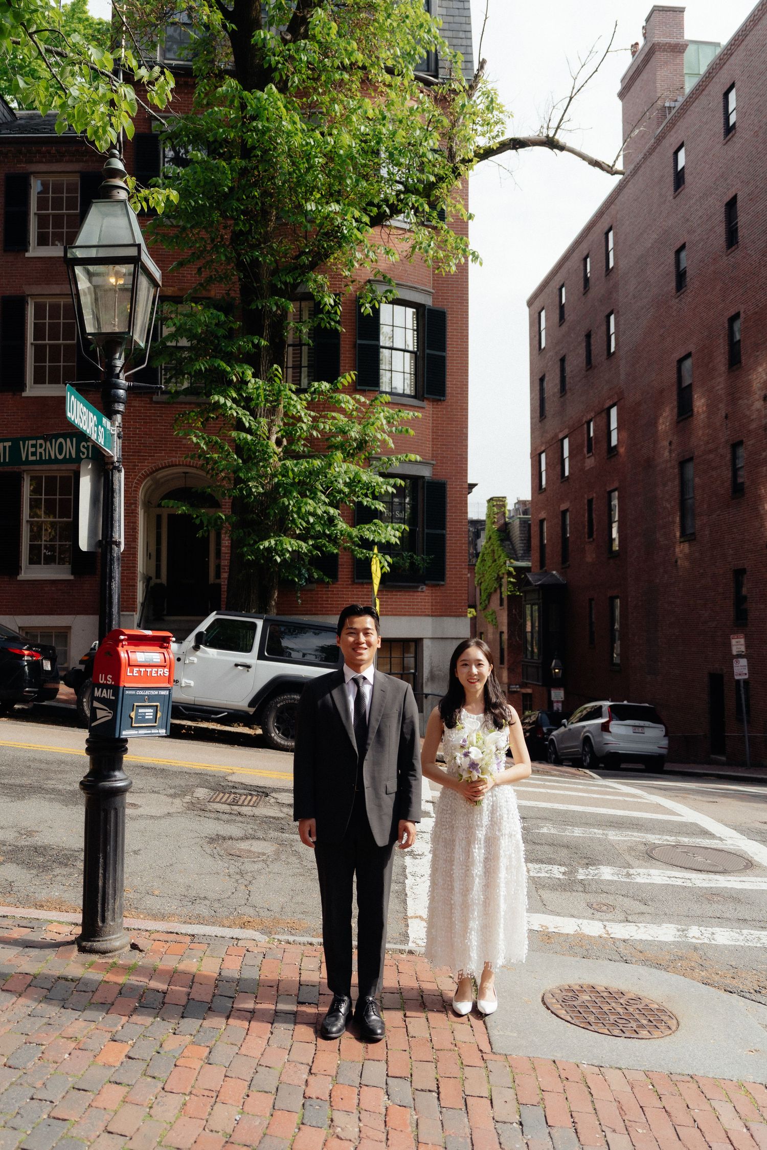 Beacon Hill engagement photos on Acorn Street with historic red brick buildings.