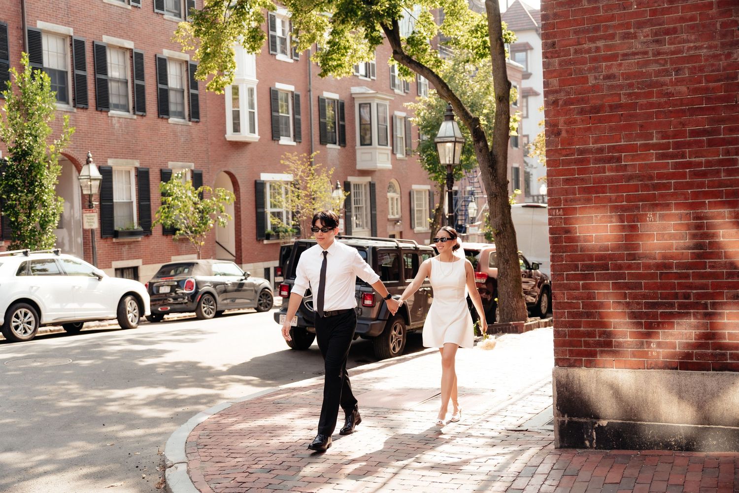 Sunny afternoon walk along tree-lined brick sidewalk in Boston's historic district.