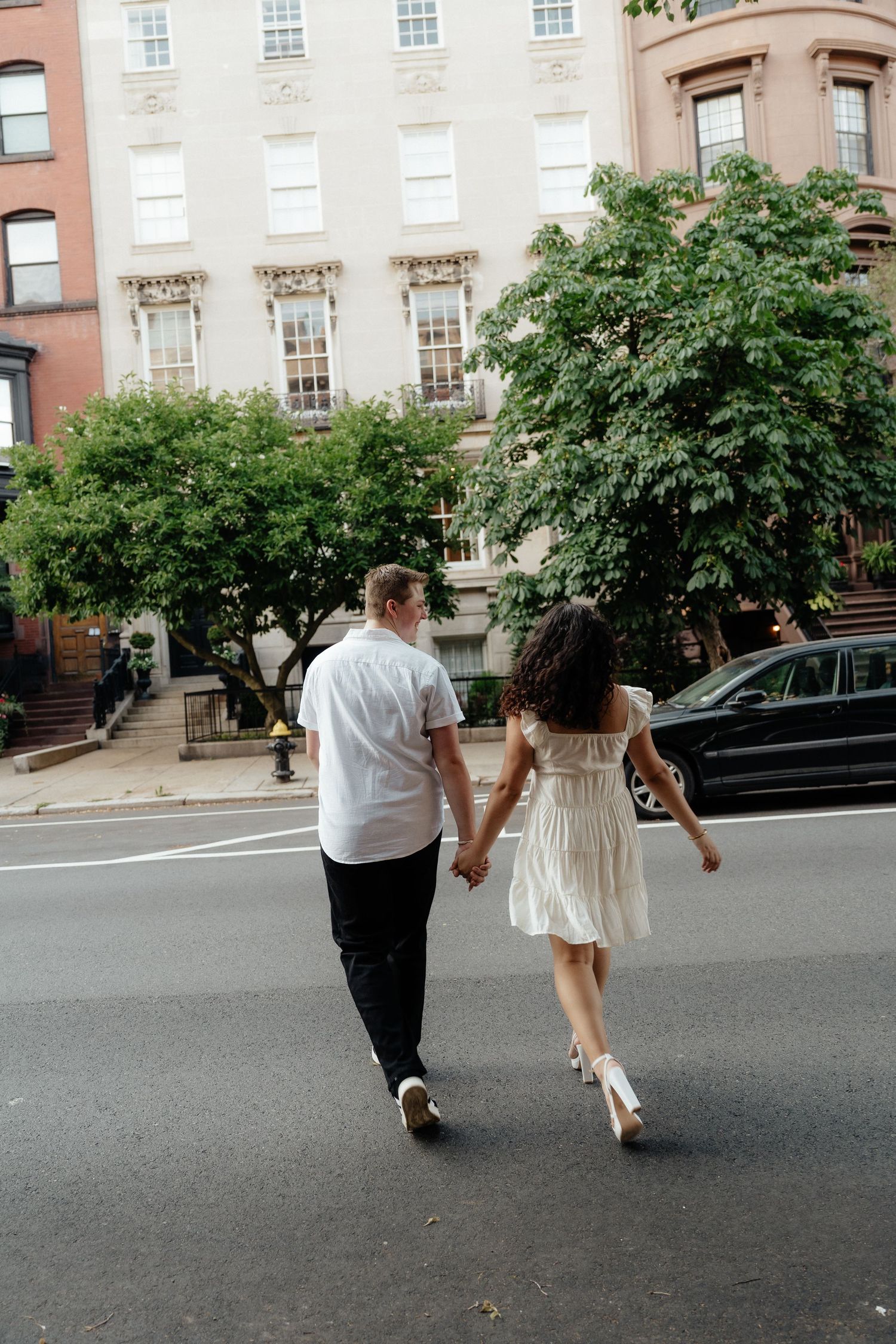 Beacon Hill engagement photos on Acorn Street with historic red brick buildings.
