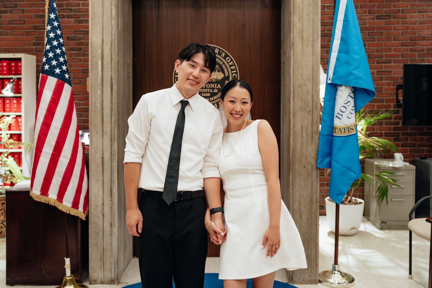 A series of romantic dance poses shown in front of American flags and government seals.