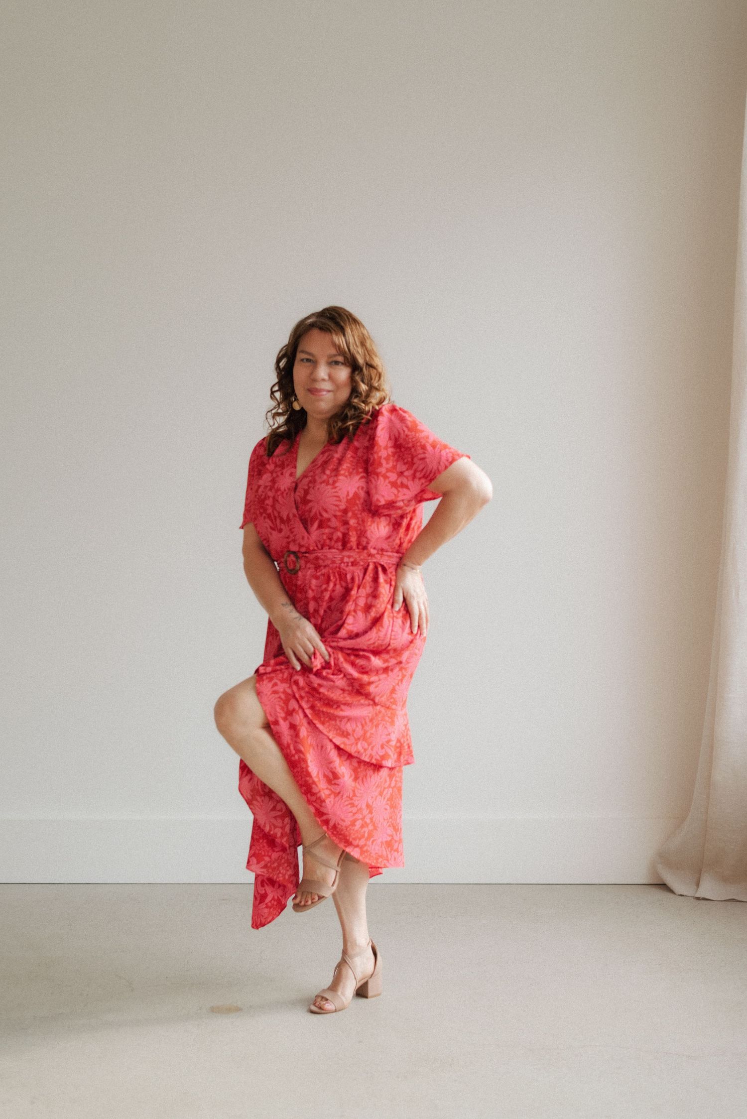 Dynamic fashion poses of woman in coral dress showing movement and personality.