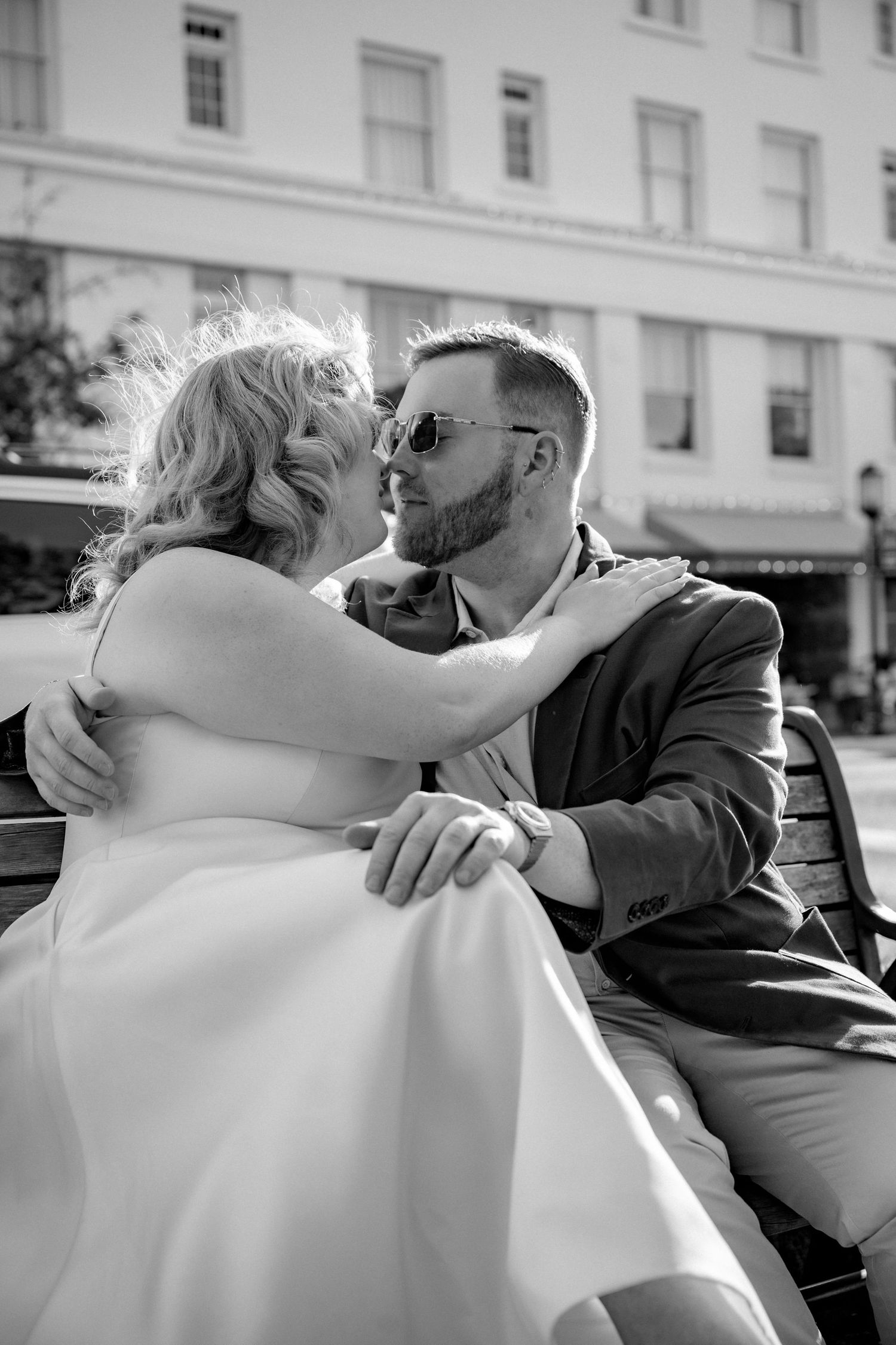 Intimate black and white sequence showing a couple embracing outdoors.