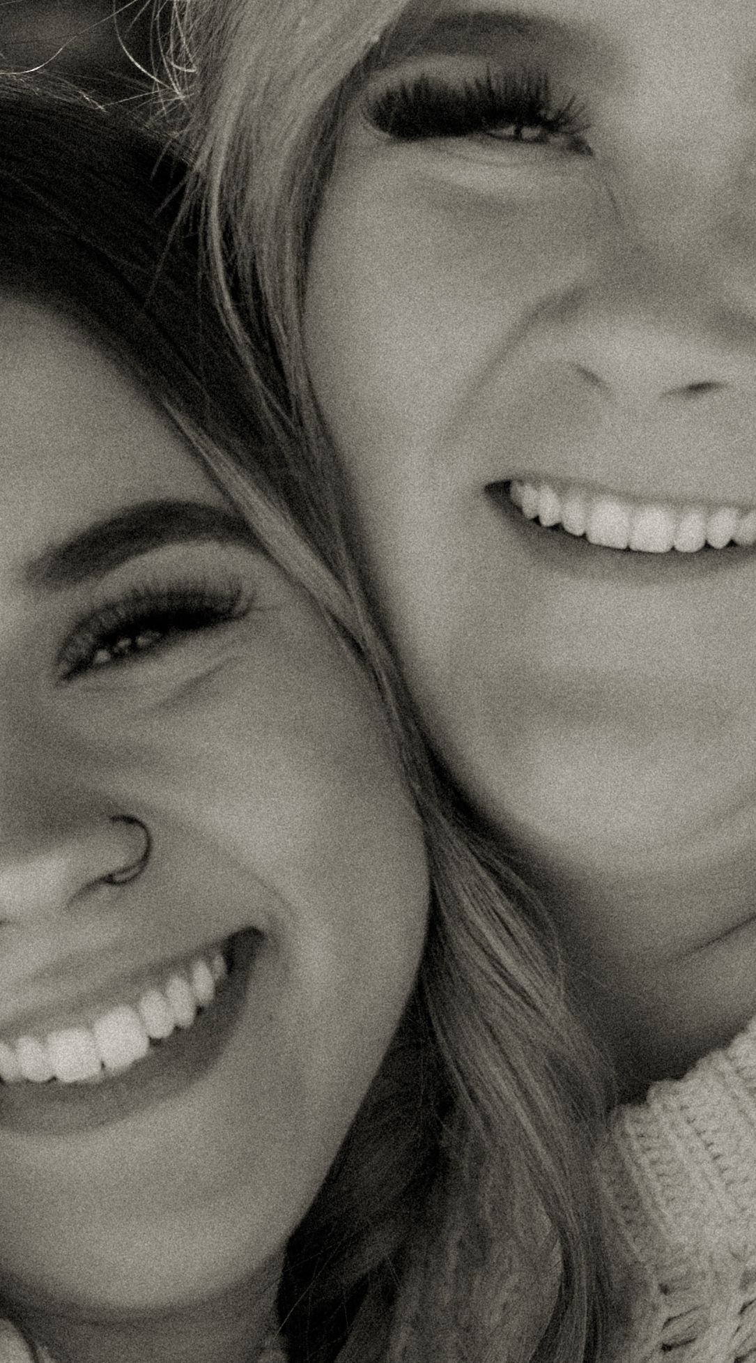 Series of close-up black and white portraits showing joyful expressions.