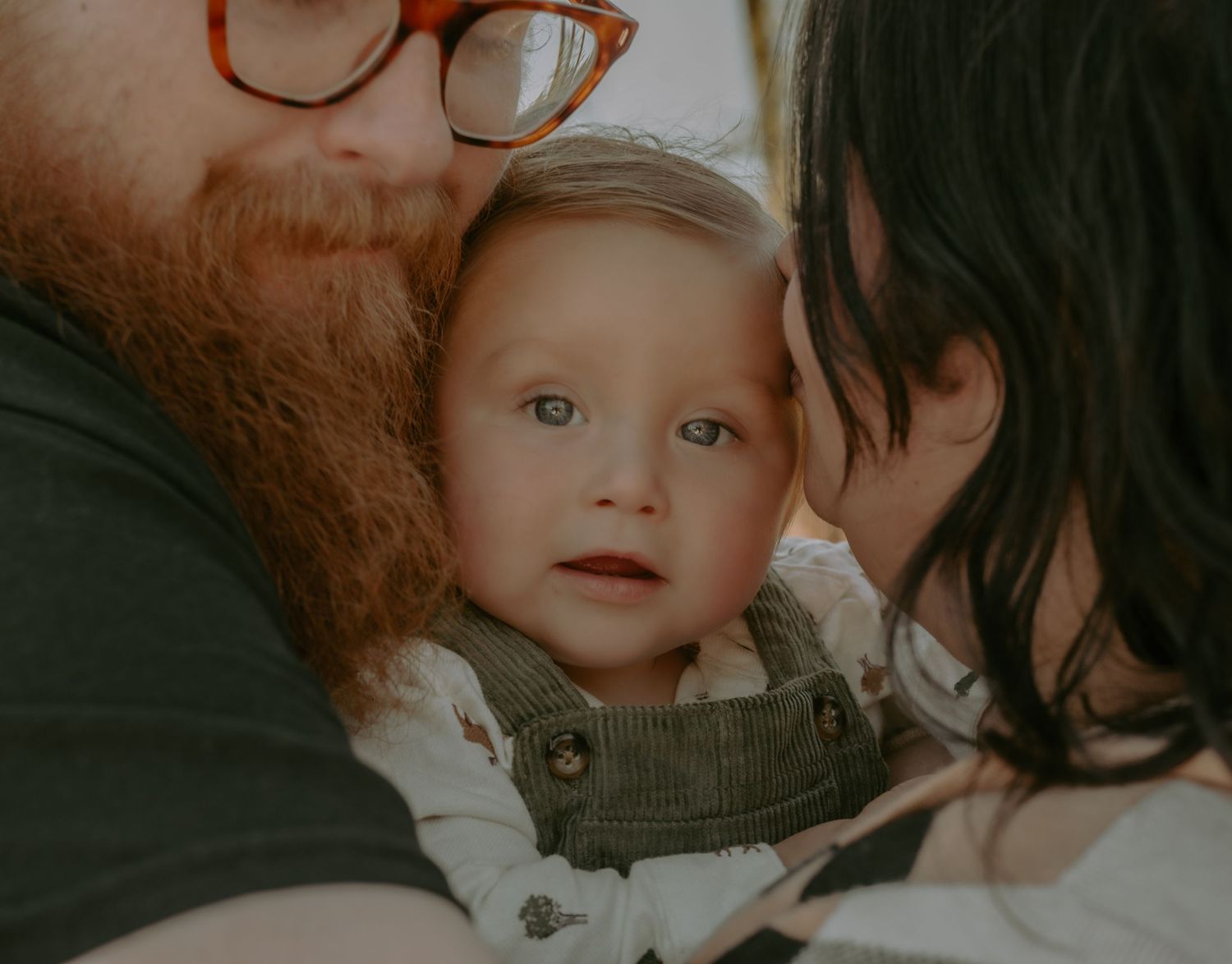 Close up intimate family moment captured in warm lighting.
