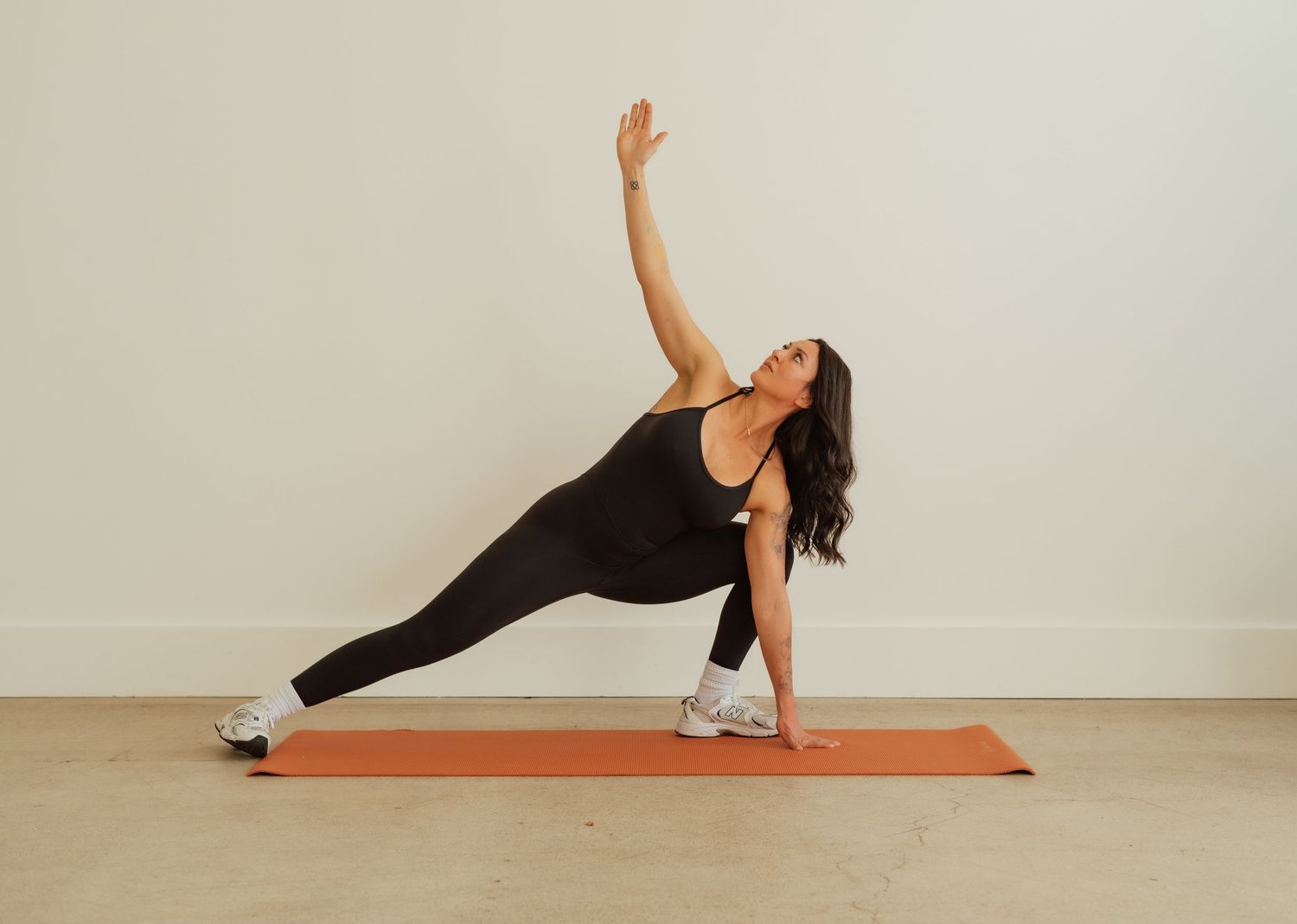 Sequence of yoga poses demonstrated on an orange mat against a white wall.